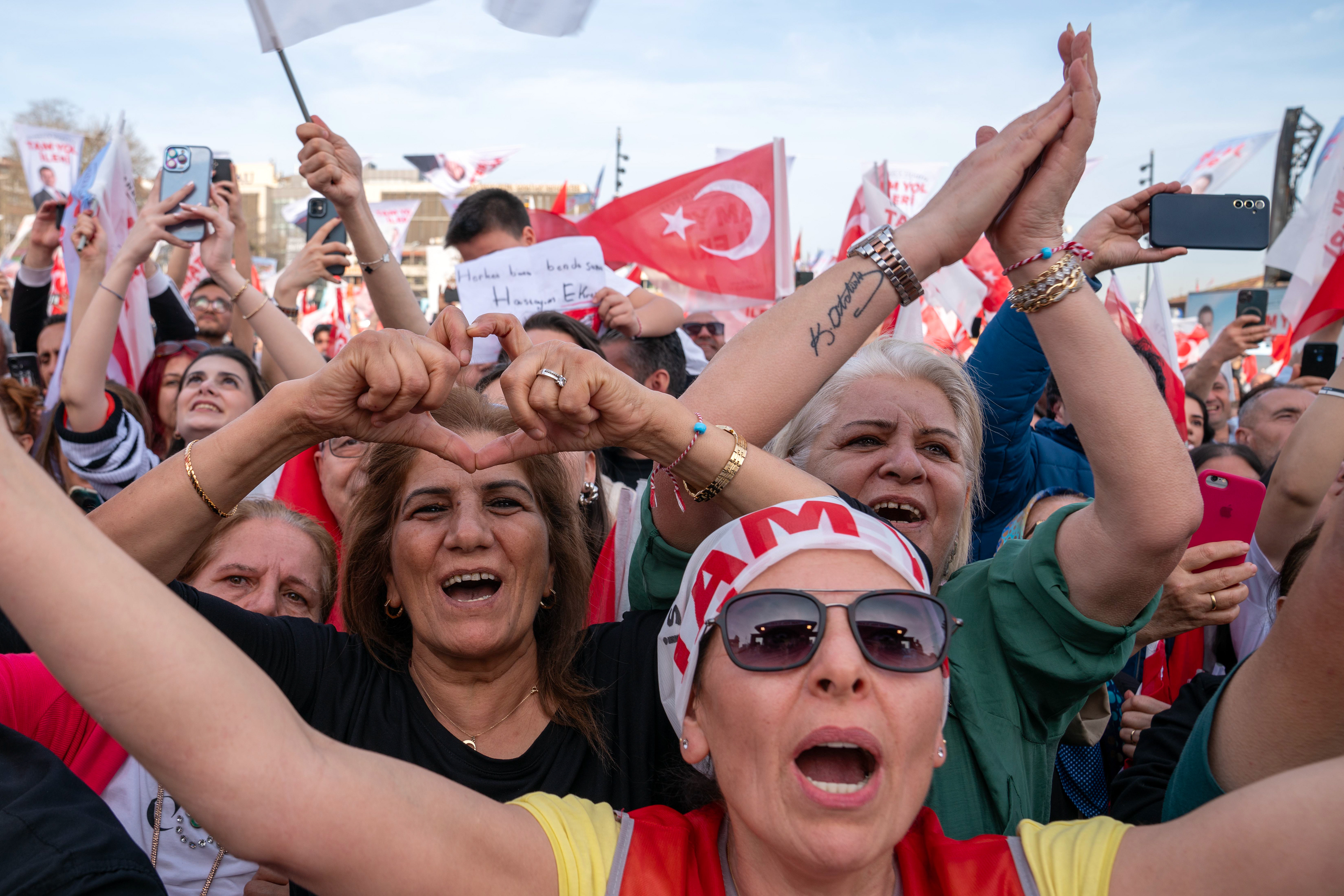 Supporters of Istanbul Metropolitan Municipality Mayor and opposition mayor candidate Ekrem Imamoglu, wave Turkish flags and shout slogans during campaign rally in Besiktas, Istanbul on March 30, 2024, ahead of Turkish Local elections on March 31, 2024.
