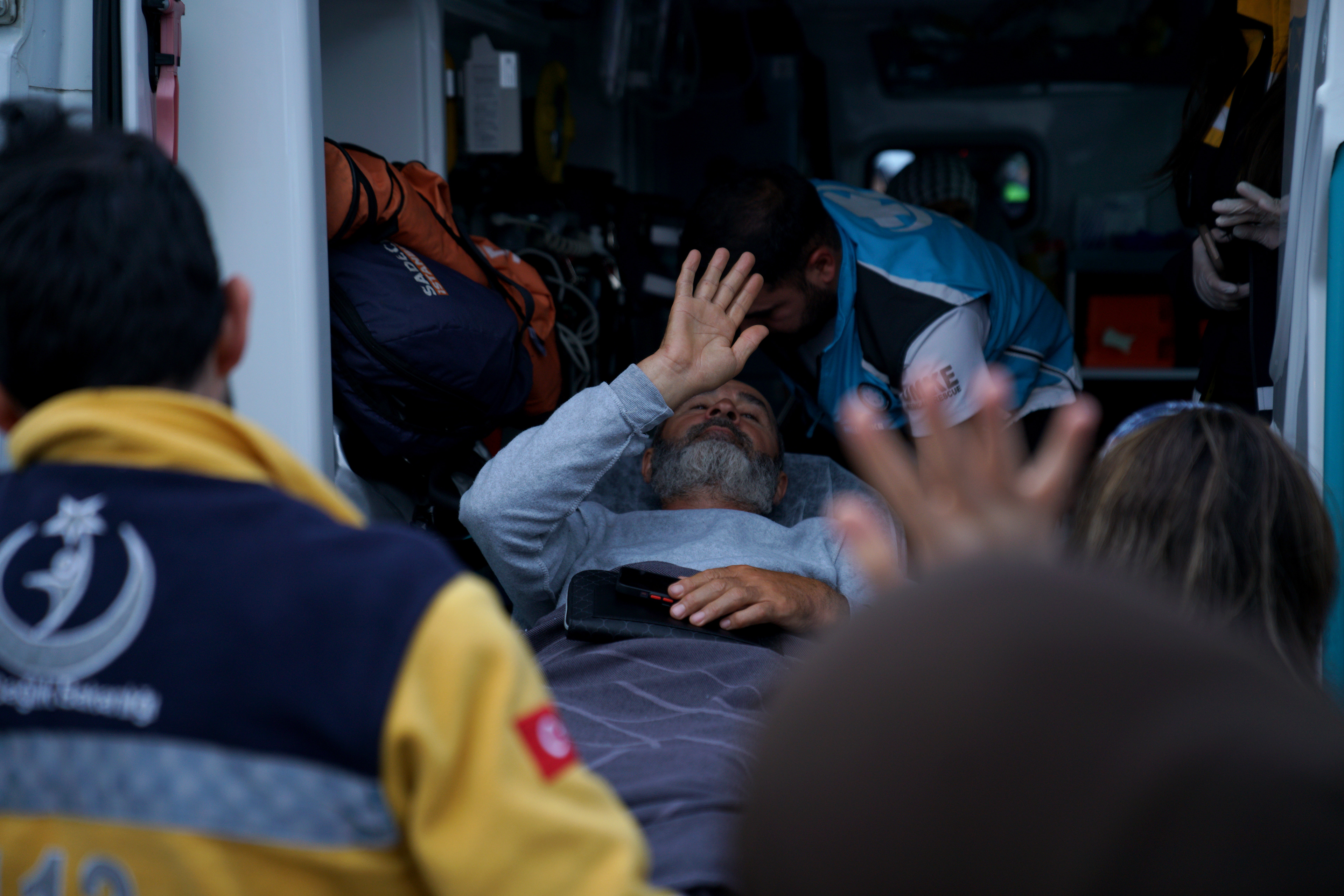 An activist, who was detained aboard the Gaza-bound Global Sumud Flotilla, which was intercepted by Israeli forces, is loaded into an ambulance on a stretcher at Istanbul International Airport after being deported, in Istanbul, Turkey, May 21, 2026.
