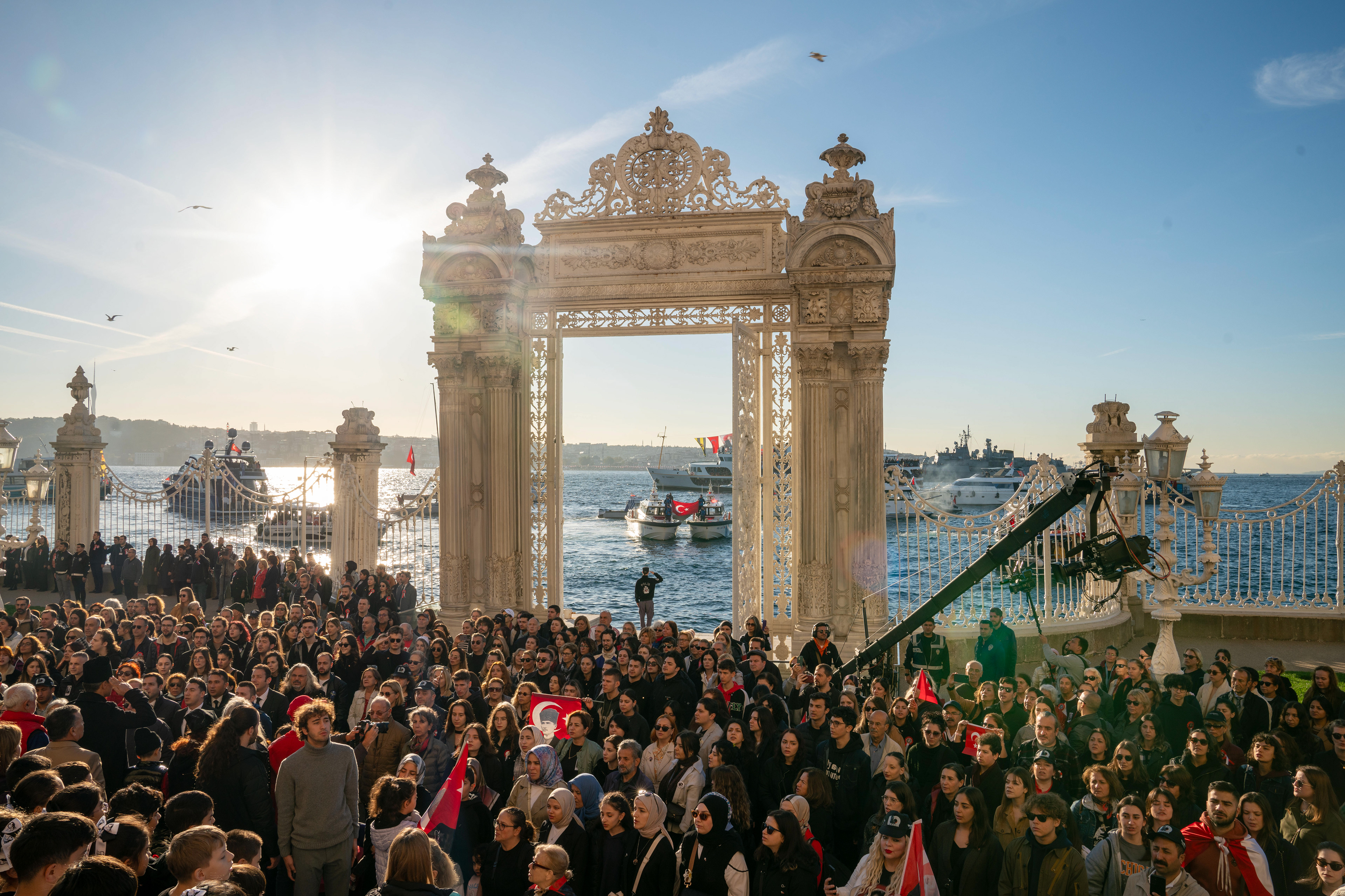 People observe a minute of silence in memory of Mustafa Kemal Ataturk at Dolmabahce Palace in Istanbul on November 10, 2023. 