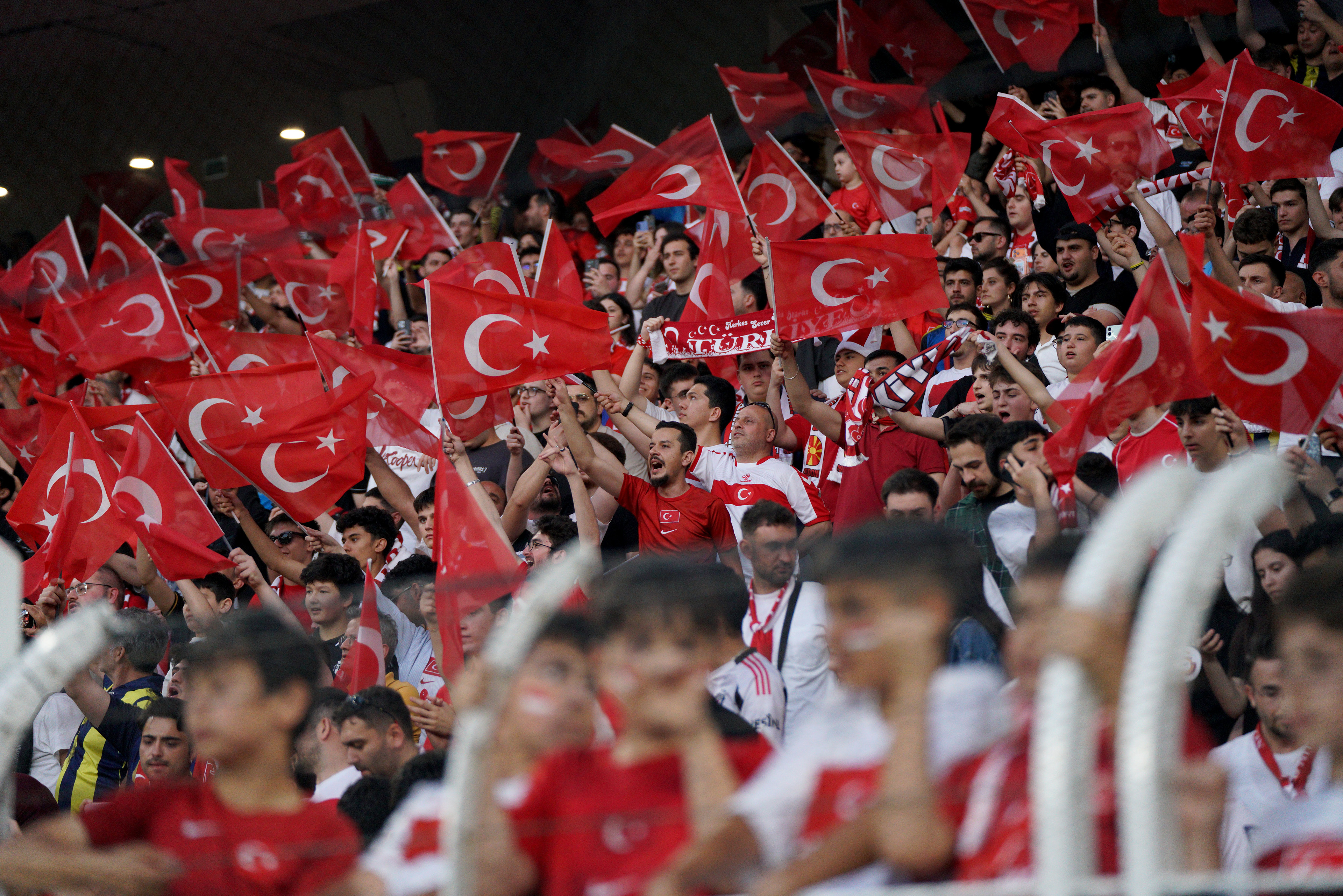Turkish national team fans chant slogans and wave Turkish flags ahead of the Turkey-North Macedonia match, to be played at Fenerbahce Sukru Saracoglu Stadium in Istanbul on June 1, 2026, as part of the preparations for the 2026 FIFA World Cup.
