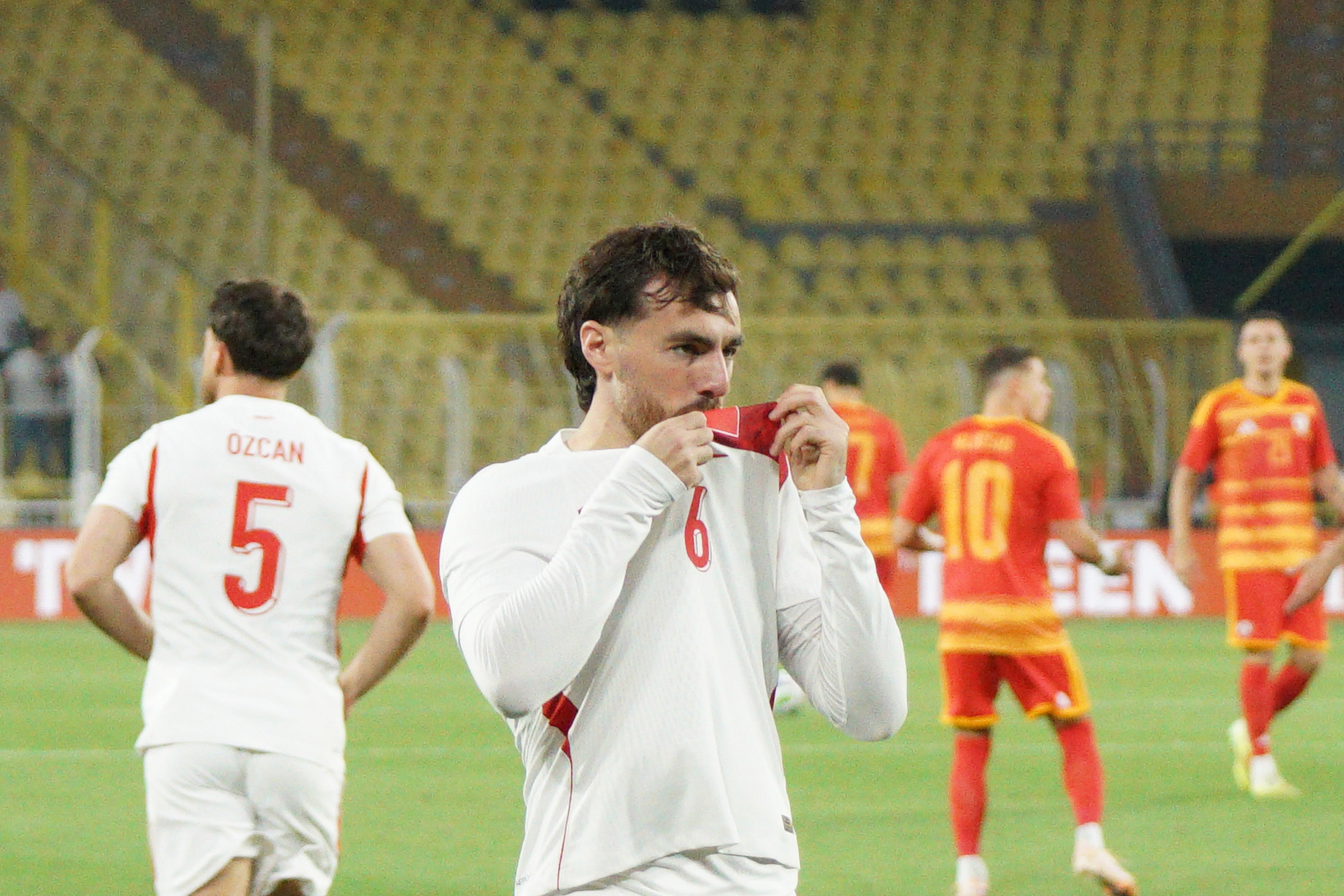 Orkun Kokcu (C) of Turkey kisses his jersey during his goal celebration after scoring a goal during the Turkey-North Macedonia match at Fenerbahce Sukru Saracoglu Stadium in Istanbul on June 1, 2026, as part of the preparations for the 2026 FIFA World Cup.