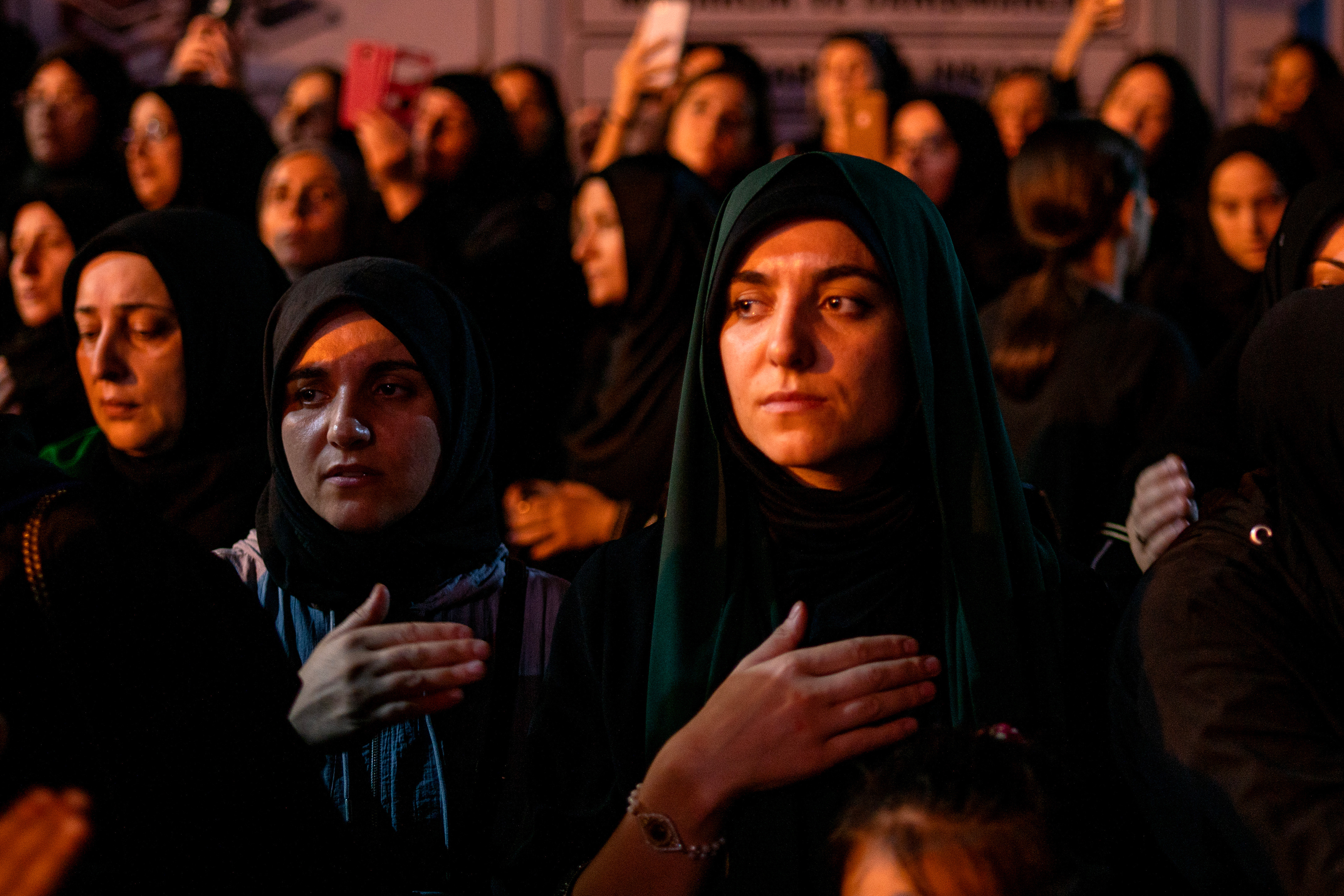 Shiite Muslims in Istanbul watch the commemoration ceremonies at the Tasua commemoration the anniversary of the martyrdom of Imam Hussein, the grandson of the Islamic Prophet Muhammad.