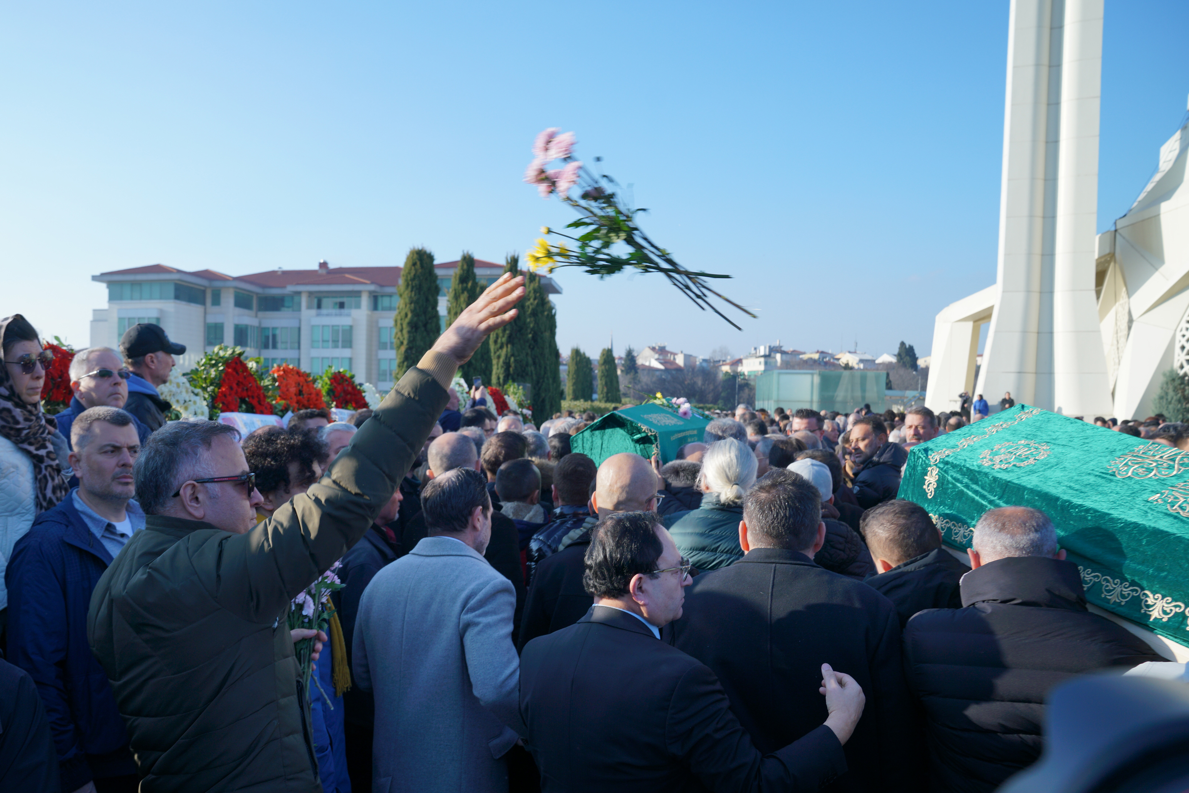 Mourners carry two coffins after the funeral of Turkish journalist Nedim Turkmen and his family in Istanbul, Turkey, 22 January 2025.