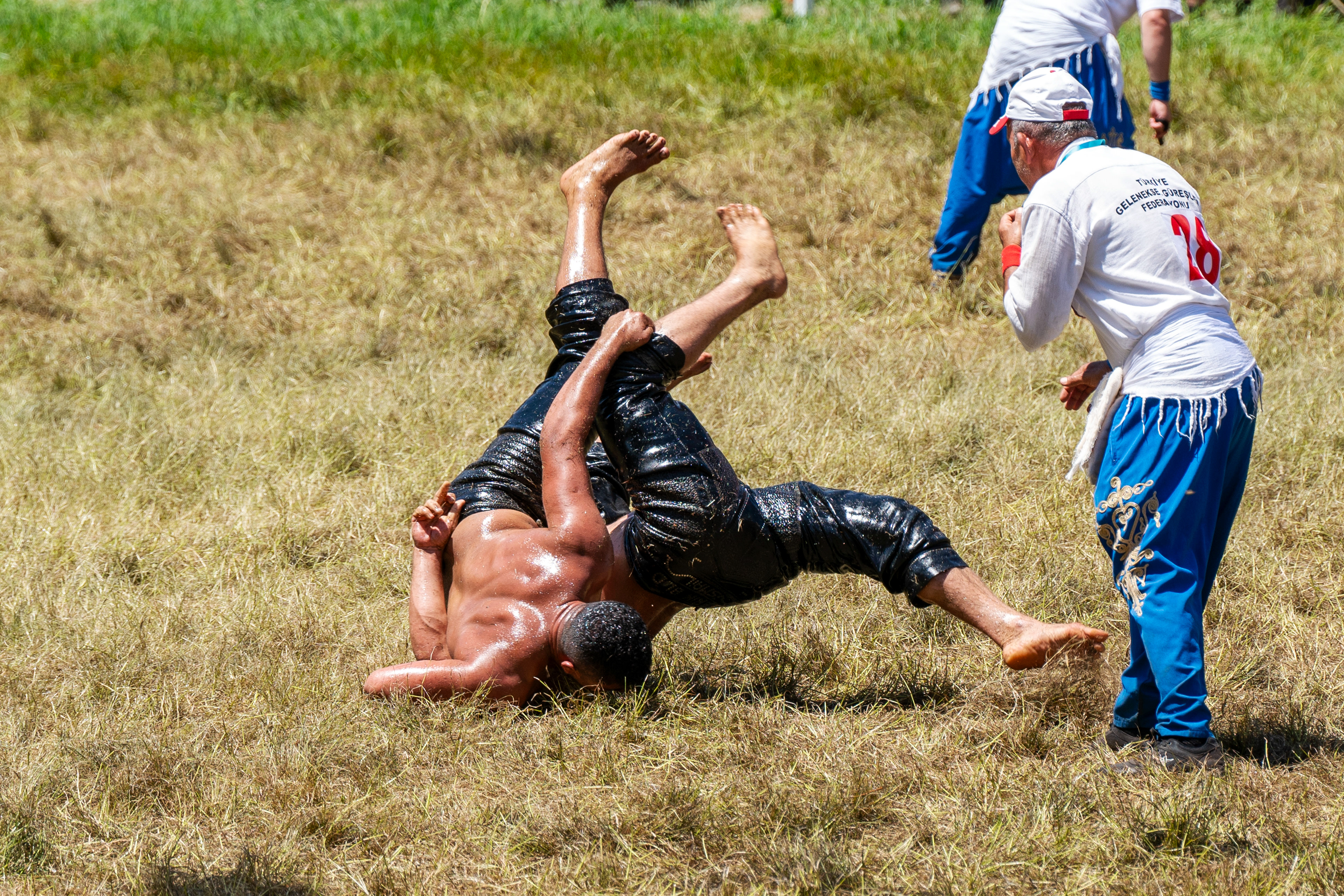 Wrestlers in action during the Kirkpinar Oil Wrestling festival in Edirne, Turkey on July 9, 2023.