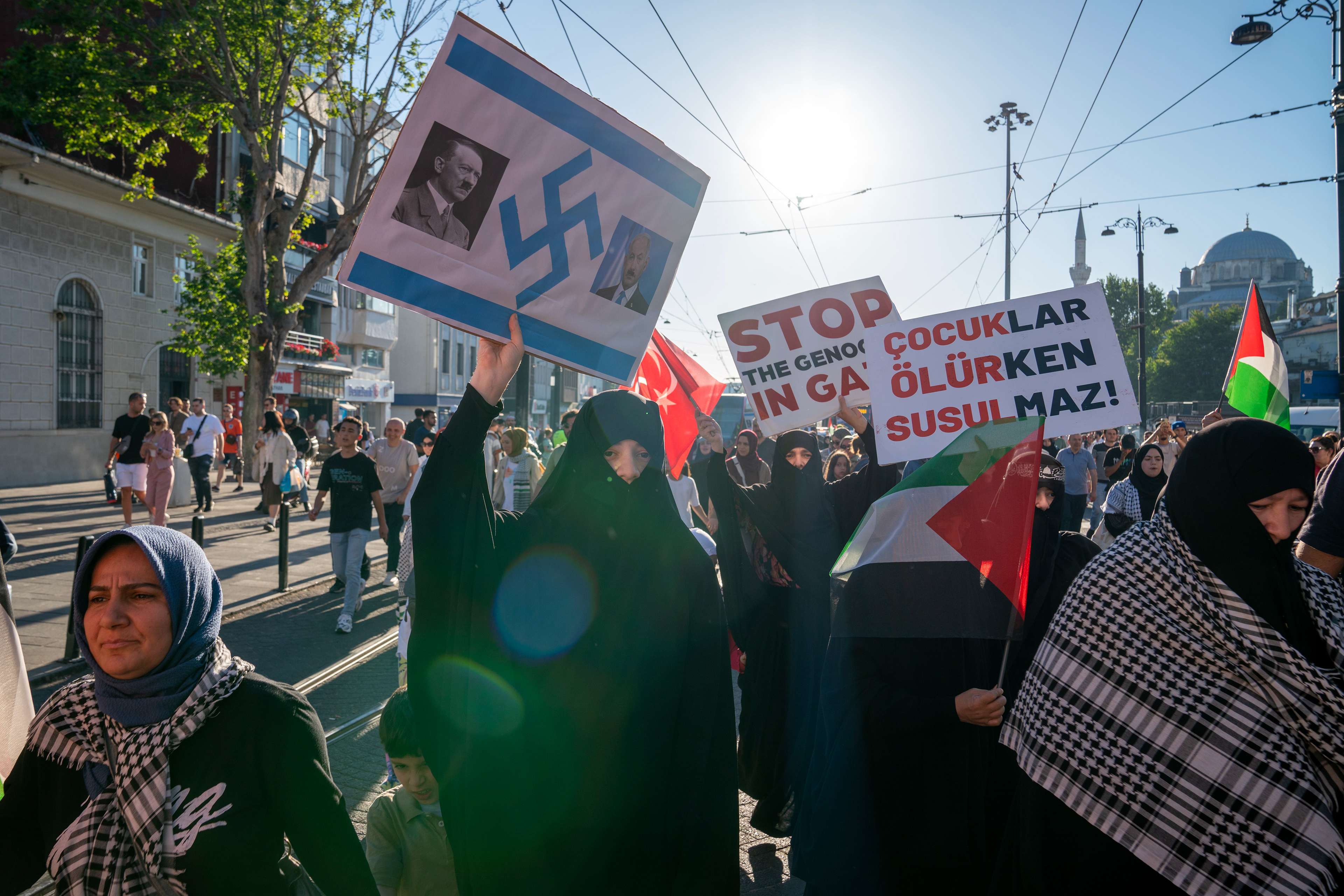 Demonstrators hold banners and shout slogans during a pro-Palestine march from the Beyazit Square to Hagia Sofia Mosque in Istanbul on June 1, 2024.