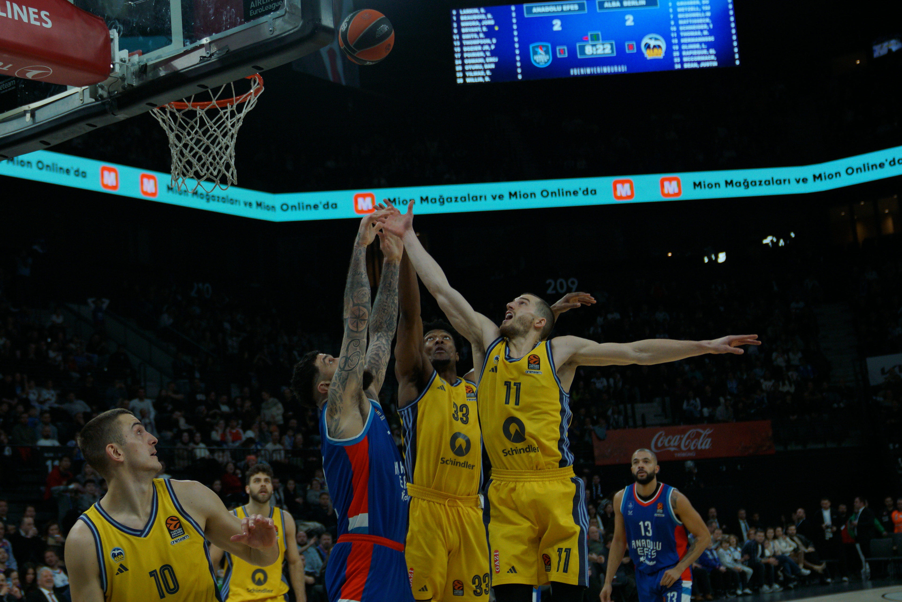 Vincent Poirier (C-L) of Anadolu Efes in action against David Mccormack (C) and Matt Thomas (C-R)  of Alba Berlin during the EuroLeague Basketball match between Anadolu Efes vs Alba Berlin in Istanbul, Turkey on February 28, 2025.