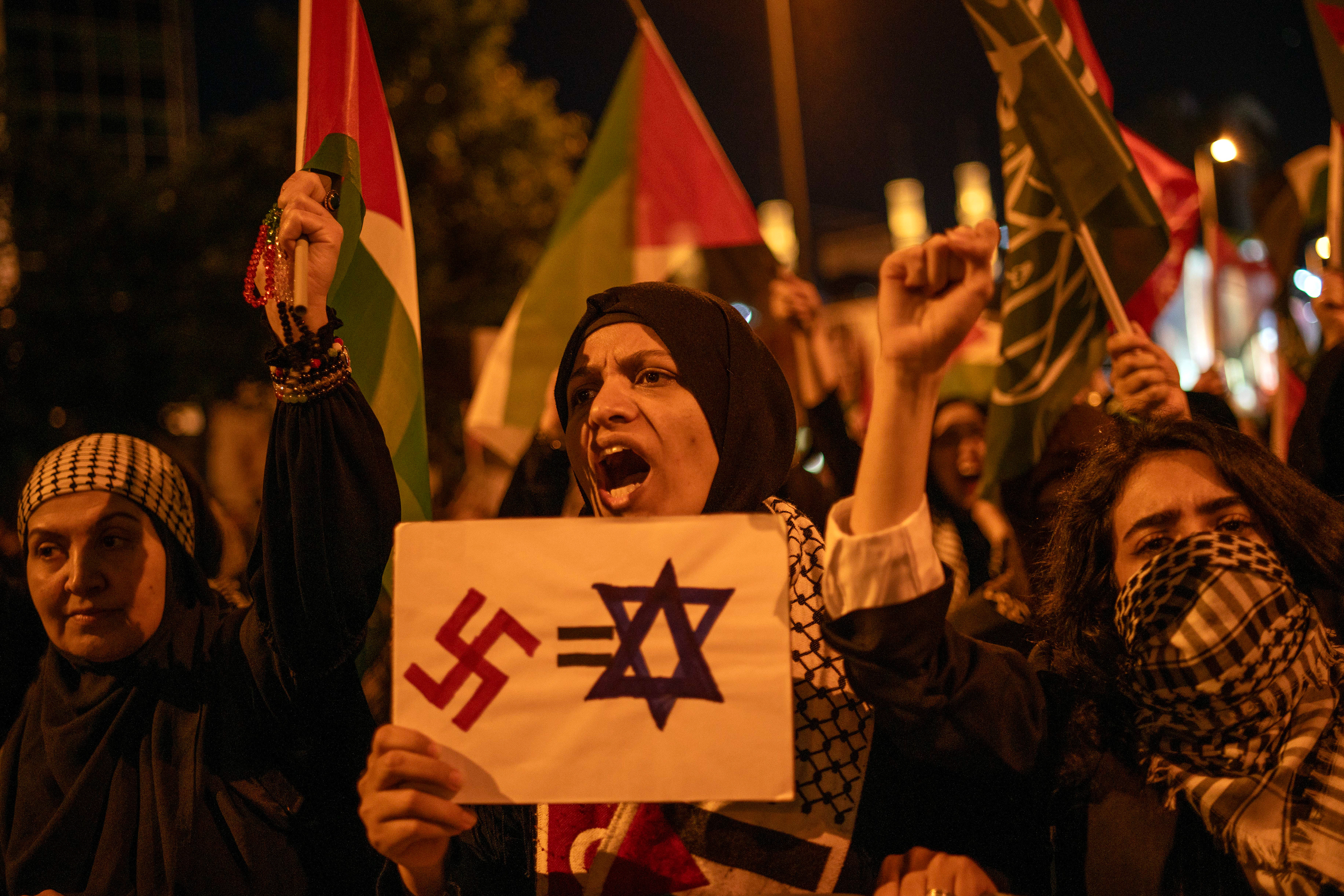 Protestors shout slogans during a protest solidarity with the Rafah people march from Barbaros Hayrettin Pasa Mosque to in front of the Israeli Consulate in Istanbul on May 27, 2024.