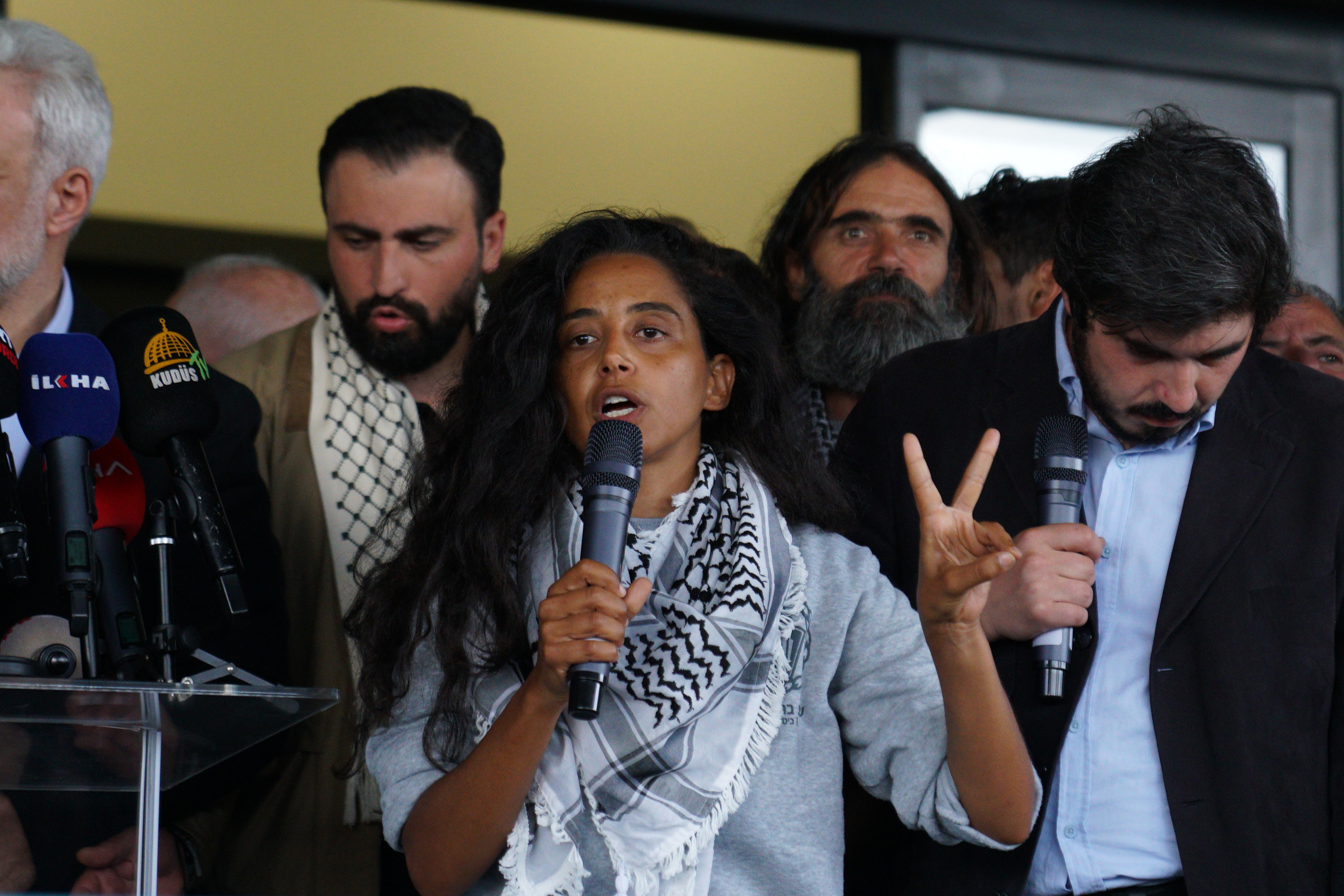 An American activist, who was detained aboard the Gaza-bound Global Sumud Flotilla, which was intercepted by Israeli forces, is speaks to the media as she arrives at Istanbul International Airport after being deported, in Istanbul, Turkey, May 21, 2026.