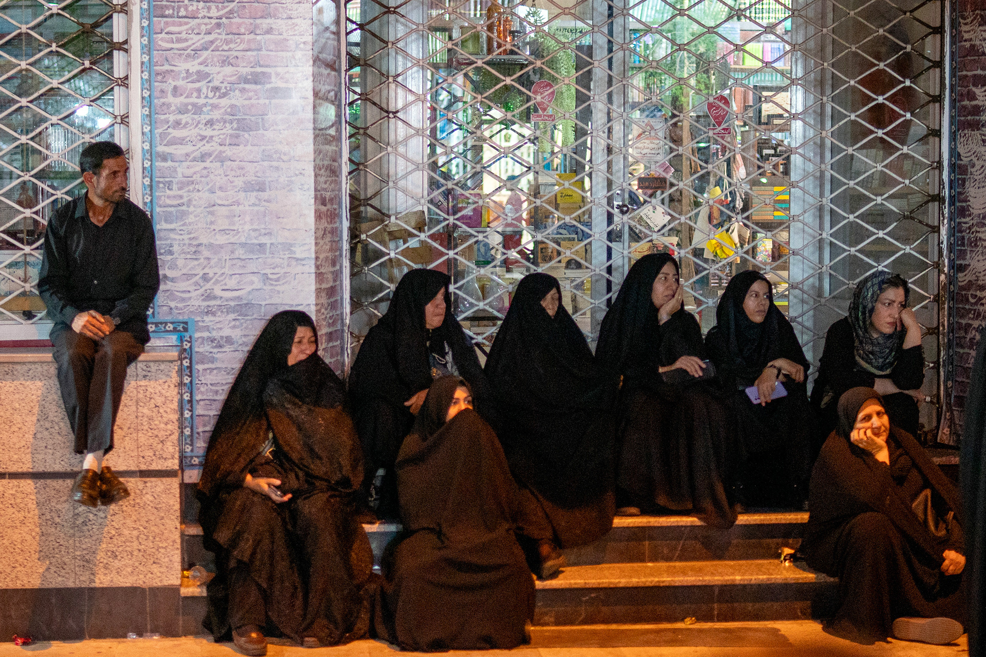 Shiite Muslims in Zanjan watch the commemoration ceremonies in Enghelab Square in Zanjan, the day after the Day of Ashura, the 1384th anniversary of Imam Hussein's martyrdom. 