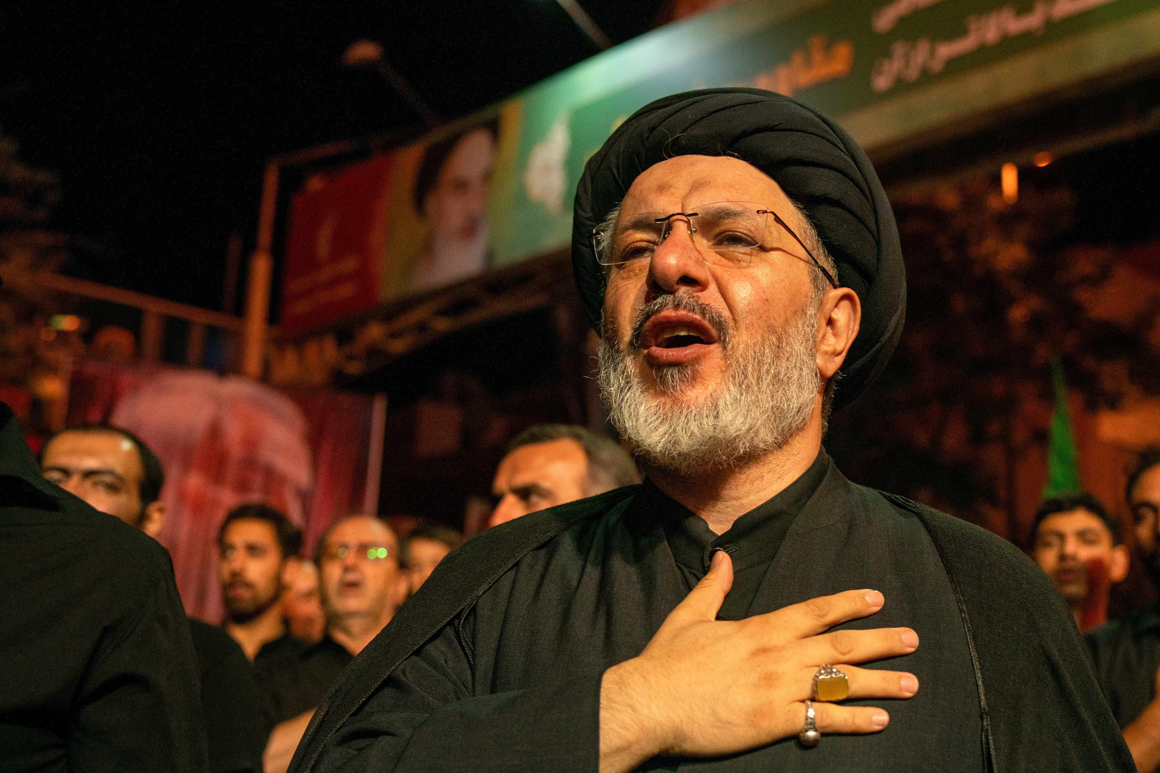 A man reacts, at the Tasua commemoration, in Tabriz, Iran on July 27, 2023, the day before Asura Day, the 1384th anniversary of the martyrdom of Imam Hussein, the grandson of the Islamic Prophet Muhammad, and 72 of his companions in Karbala. On Tasua, the ninth day of Muharram, Shiite Muslims in black mourn in squares and mosques. 