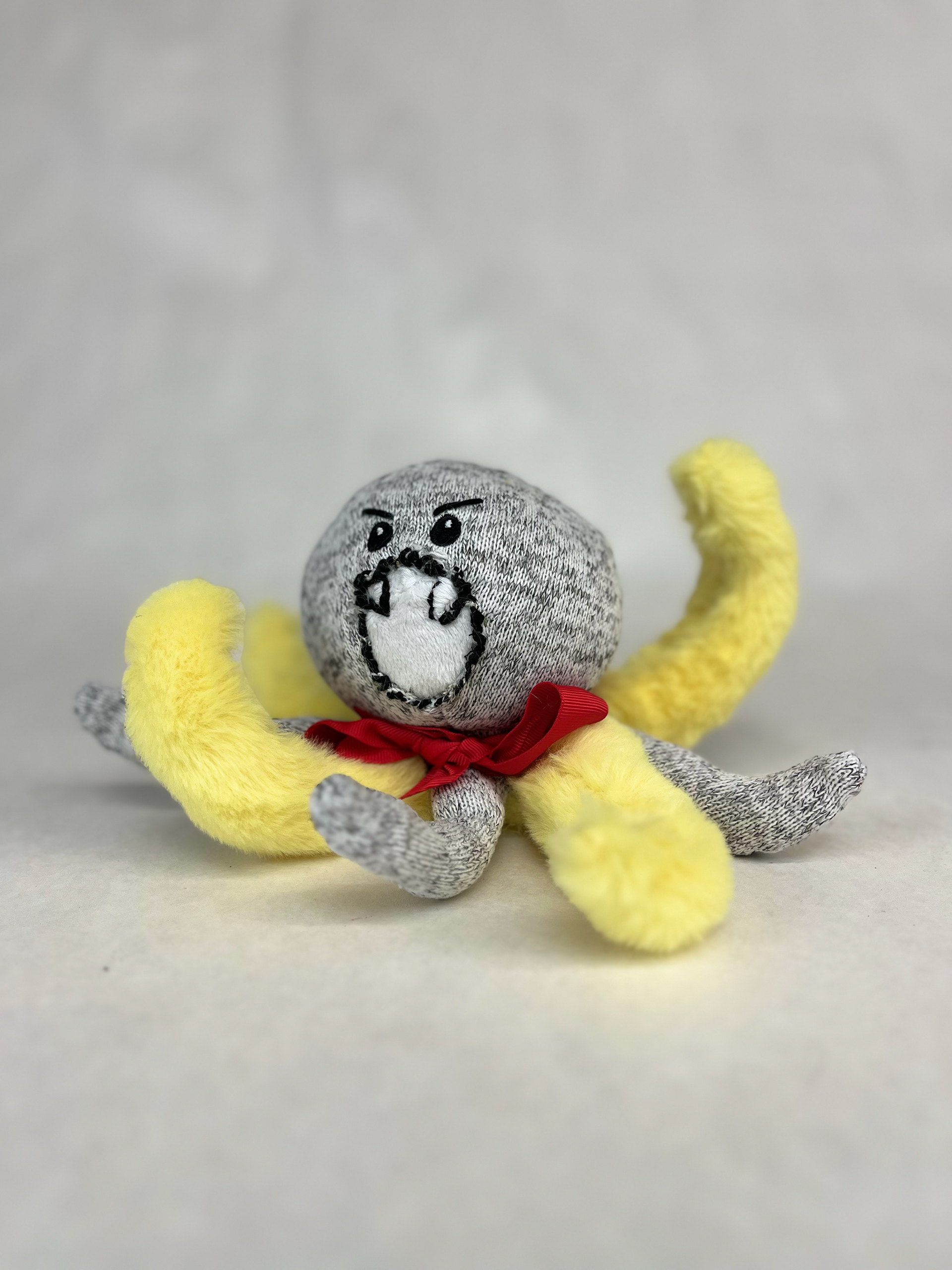 "Banana Armed Fish" is a soft sculpture that was created be repurposing old plush animals and restructuring them to create a new creature.