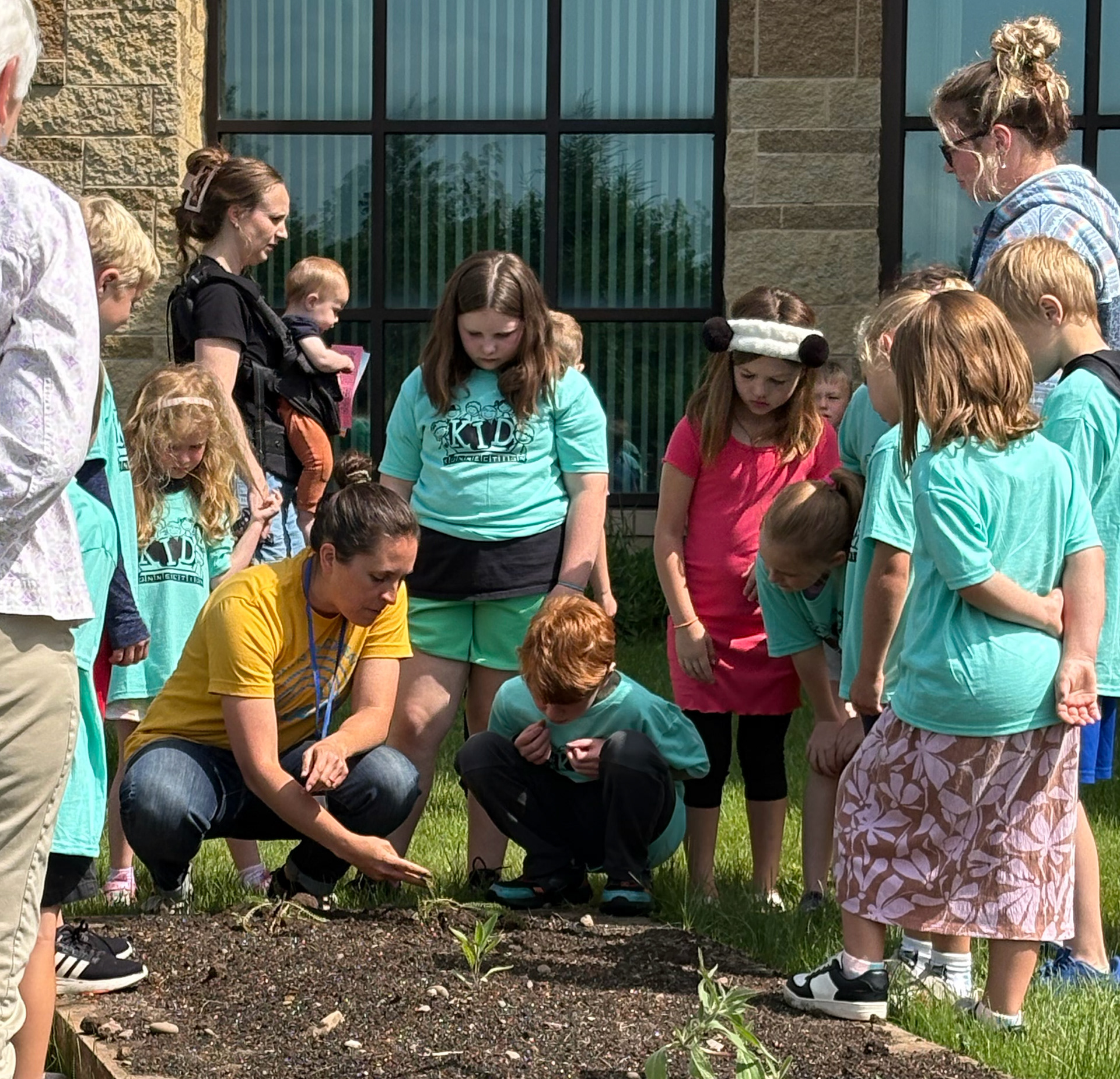 Leading Summer Reading Program and serving as a CWC Master Gardener, identifying native plants at Eagle View Elementary School