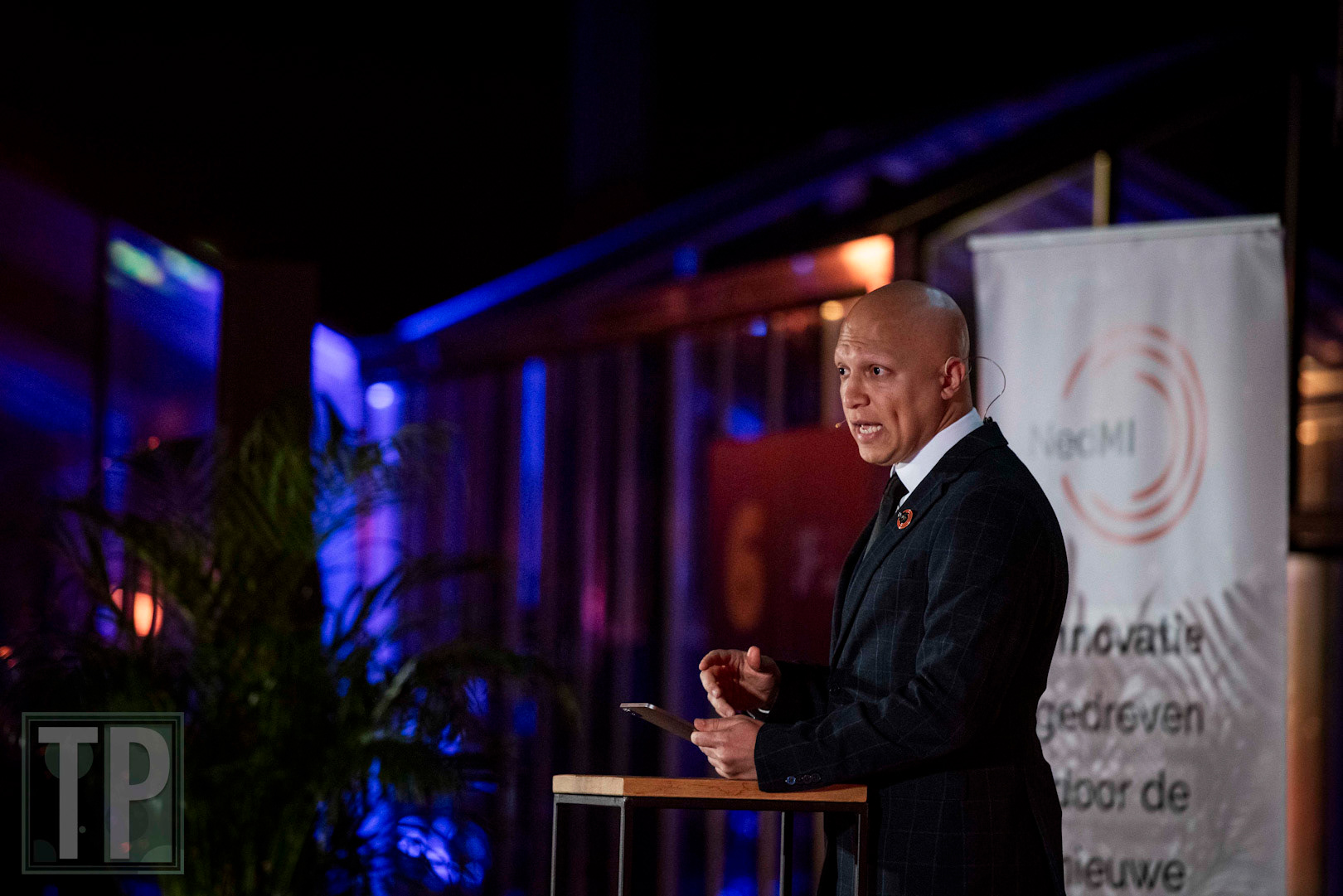 Nederland Maakt Impact President Hoessein Alkisaei delivers opening remarks to a panel discussion during NMI 2025.