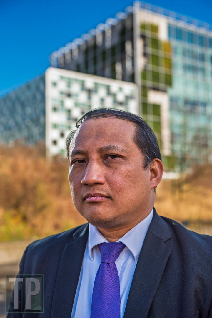 Attorney for victims of Philippines former President Rodrigo Duterte's war on drugs, Gilbert T. Andres, stands outside the International Criminal Court (ICC) as two groups demonstrated on March 12, 2025—one supporting the arrest of former President Duterte for his war on drugs, the other condemning it as politically motivated.