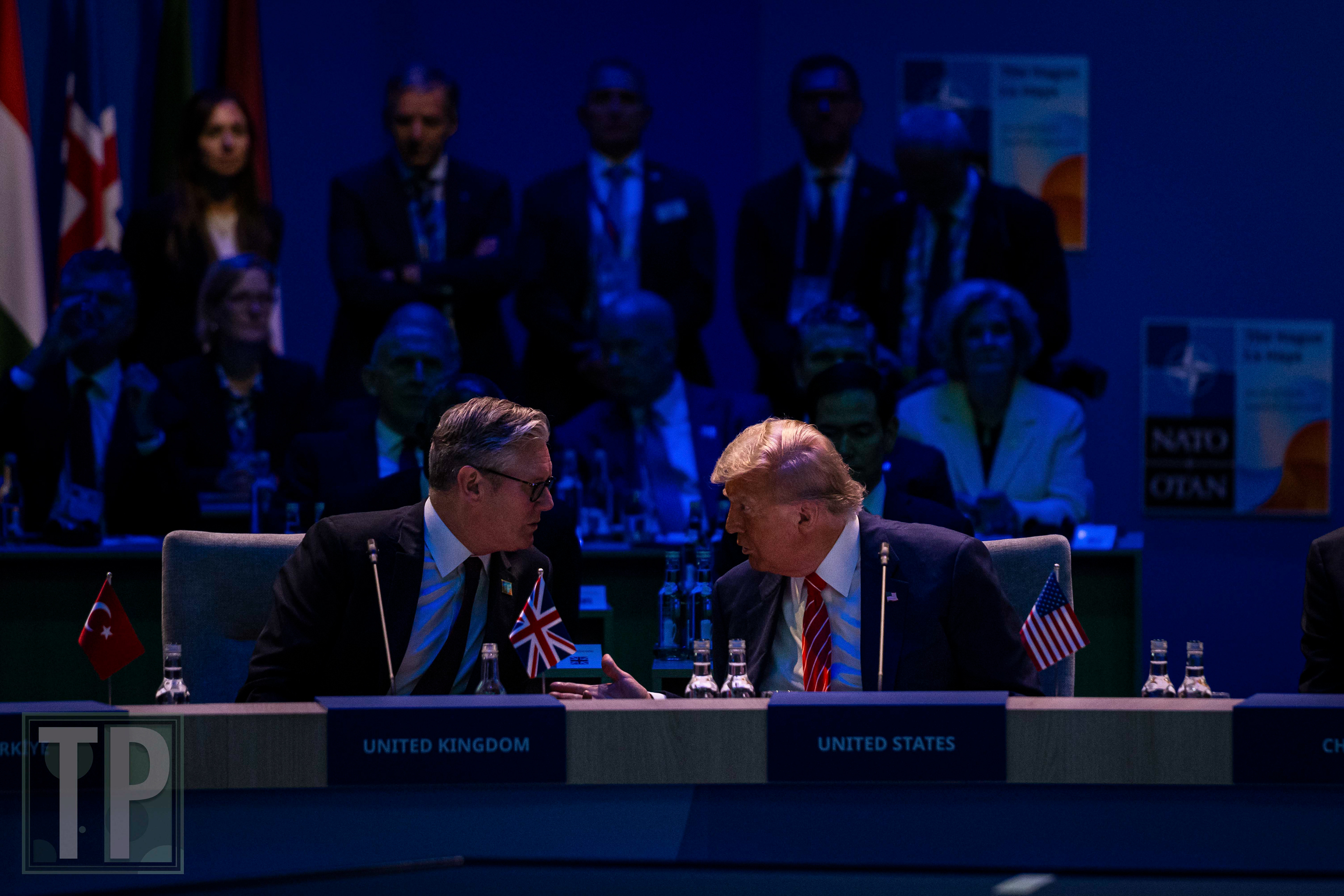 US President Donald Trump engages in a conversation with Prime Minister Keir Starmer of the United Kingdom prior to the commencement of the North Atlantic Council meeting.