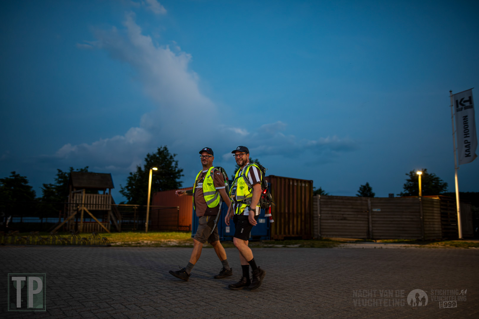 Participants of the 40-kilometre fundraising walk Nacht van de Vluchteling (Night of the Refugee) reach their halfway resting point.