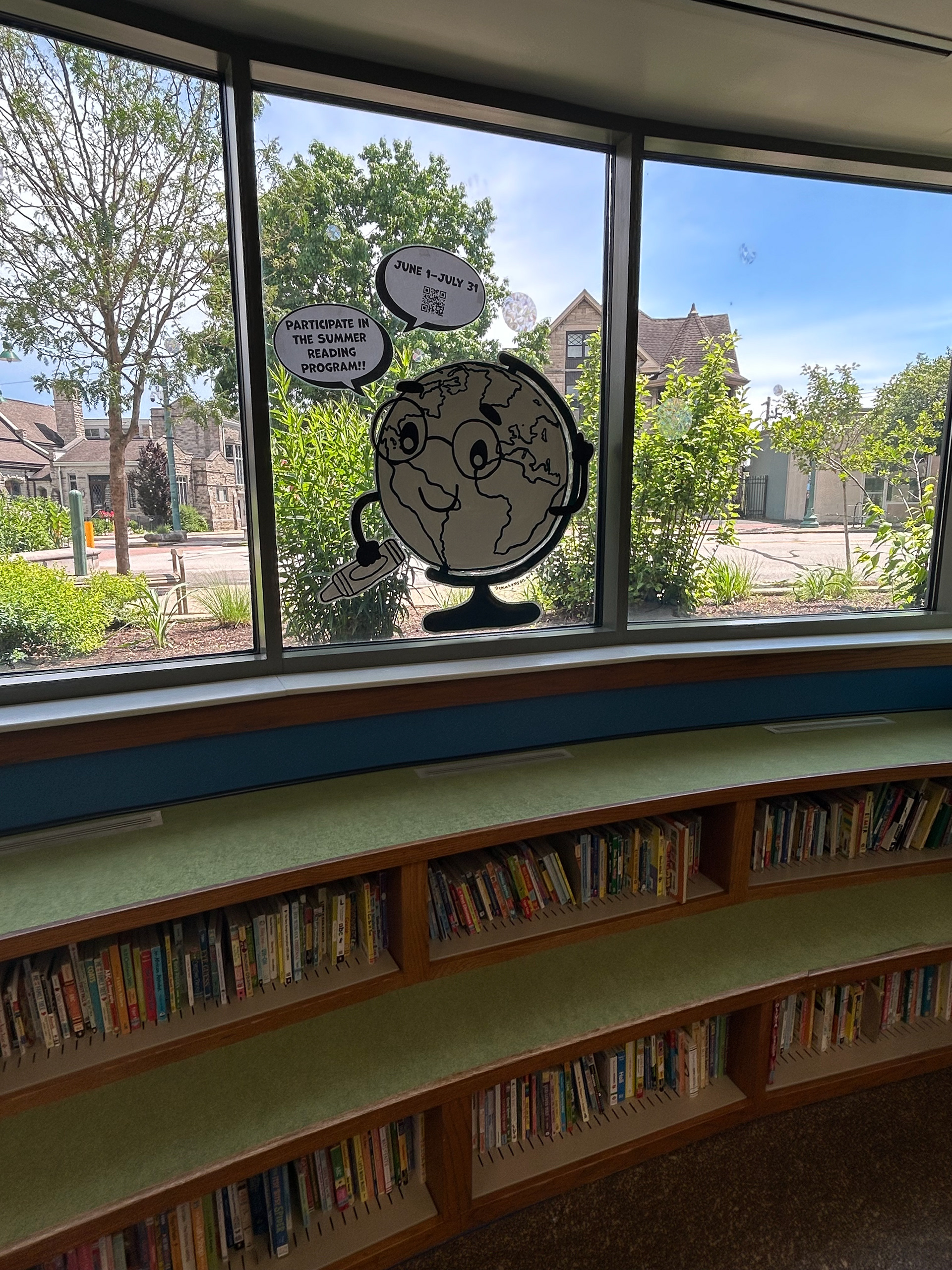 Summer Reading Window Painting Downtown Library "Color Our World" May 2025