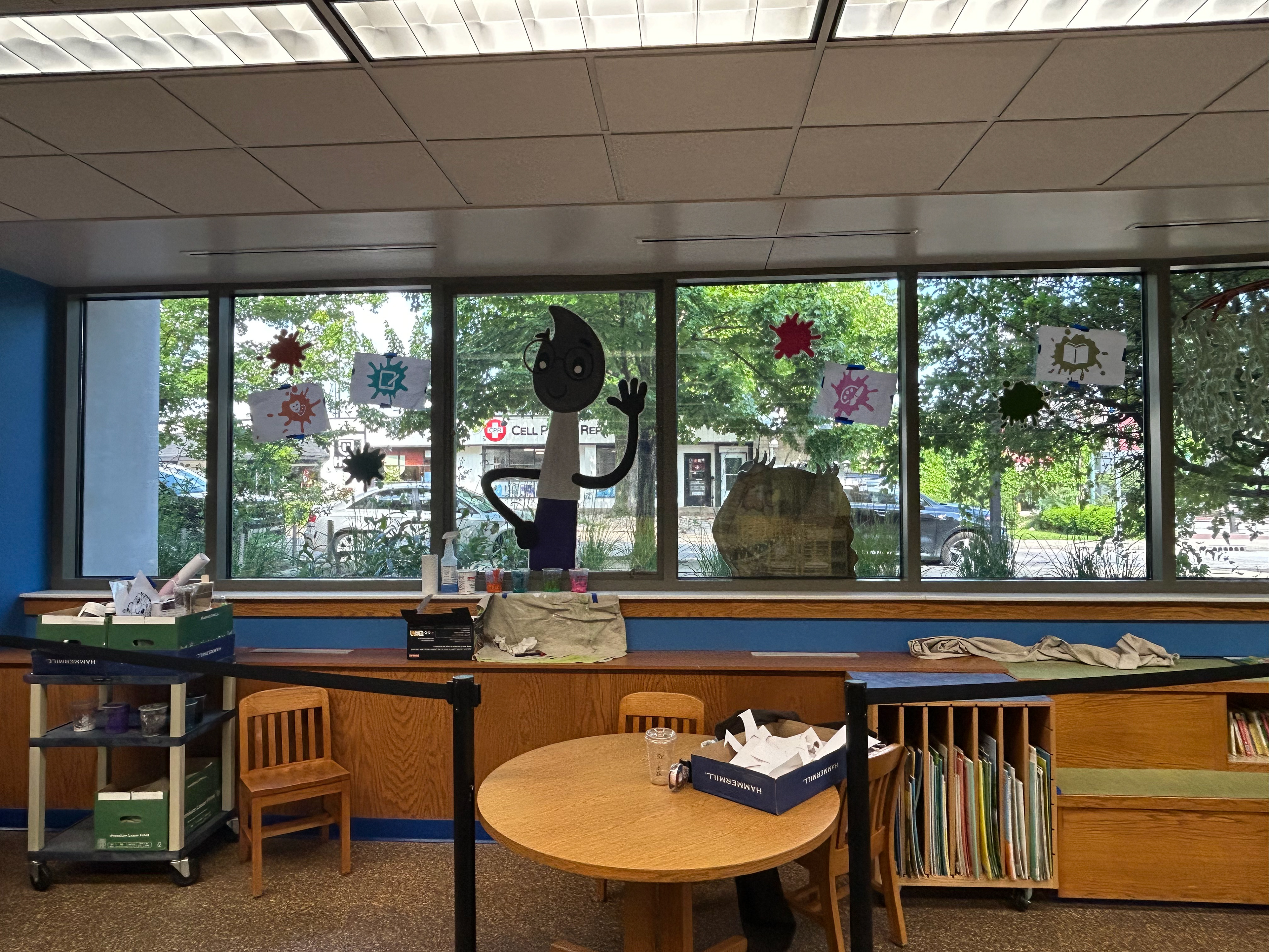 Summer Reading Window Painting Downtown Library "Color Our World" May 2025
