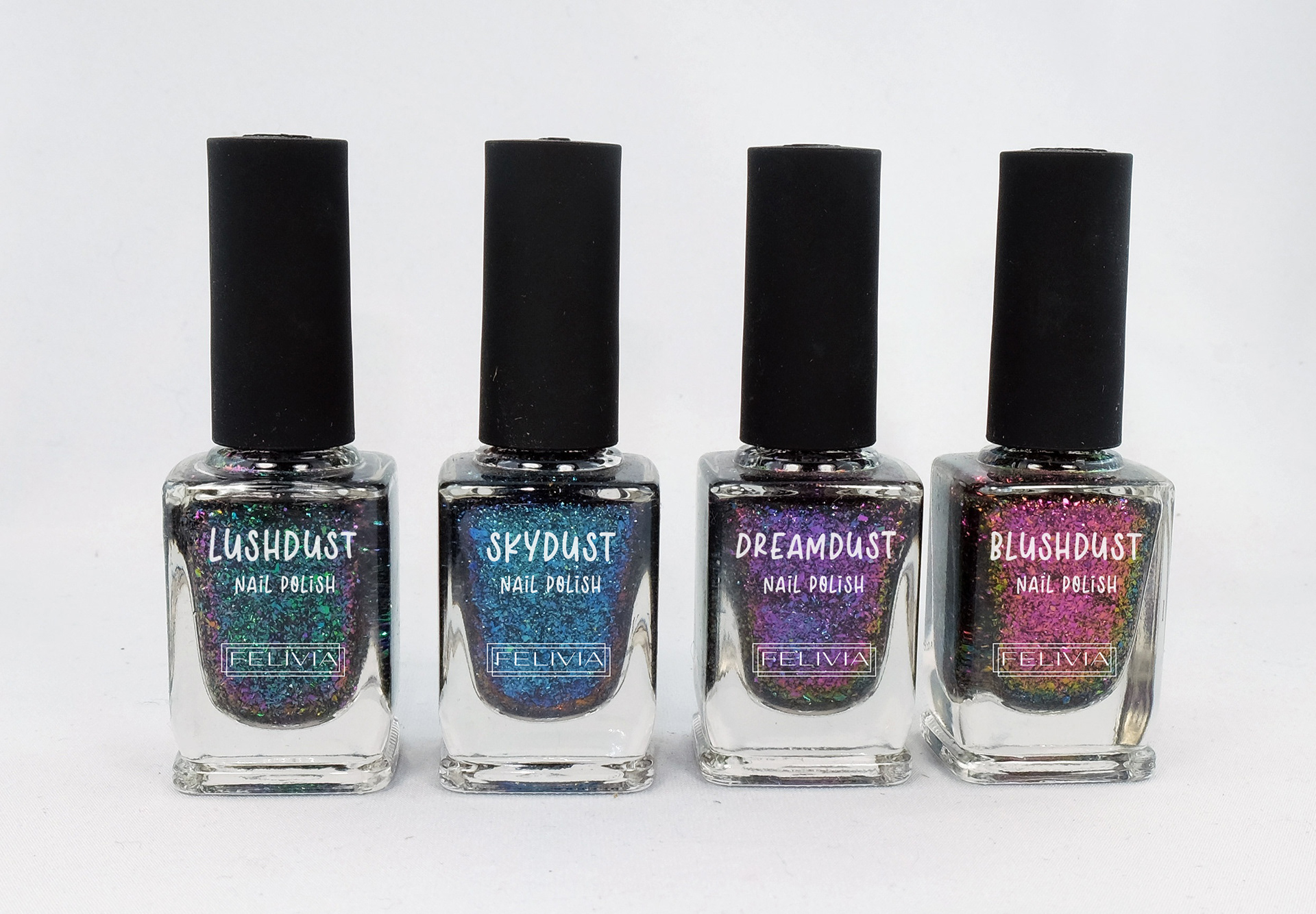 A colorful and expressive nail polish collection from Felivia, with holographic labels and unique names like Lushdust and Dreamdust.