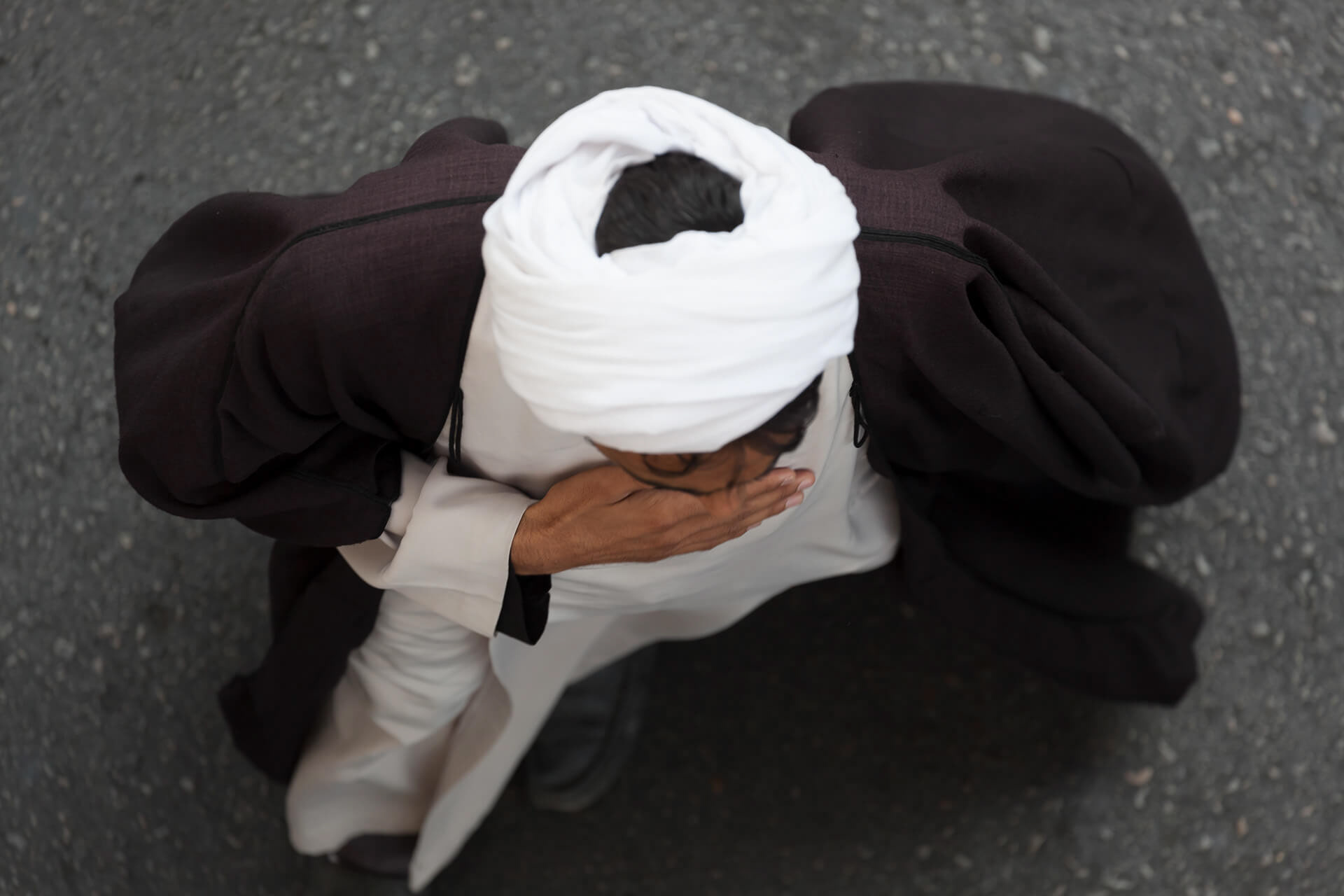 An imam photographed from above in a procession on day of Ashura, Tehern, Iran