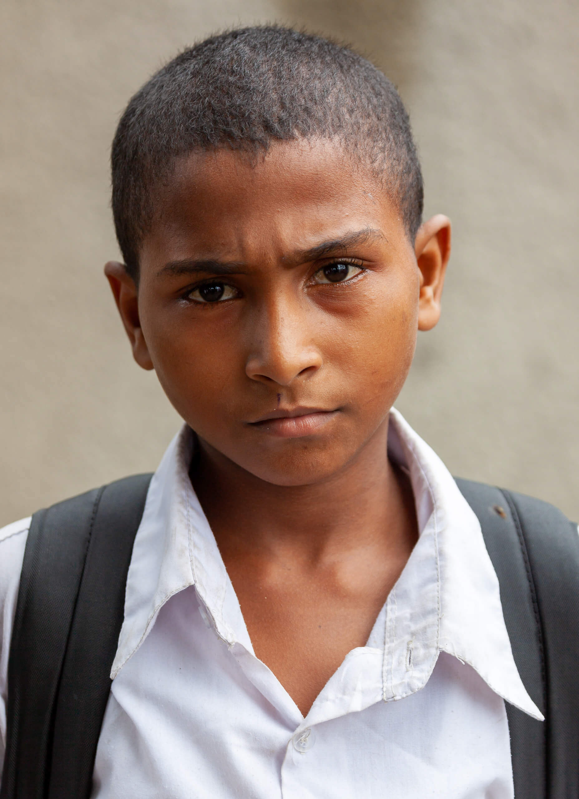 Portrait of a young schoolboy in Vingunguti, Dar es Salaam, Tanzania