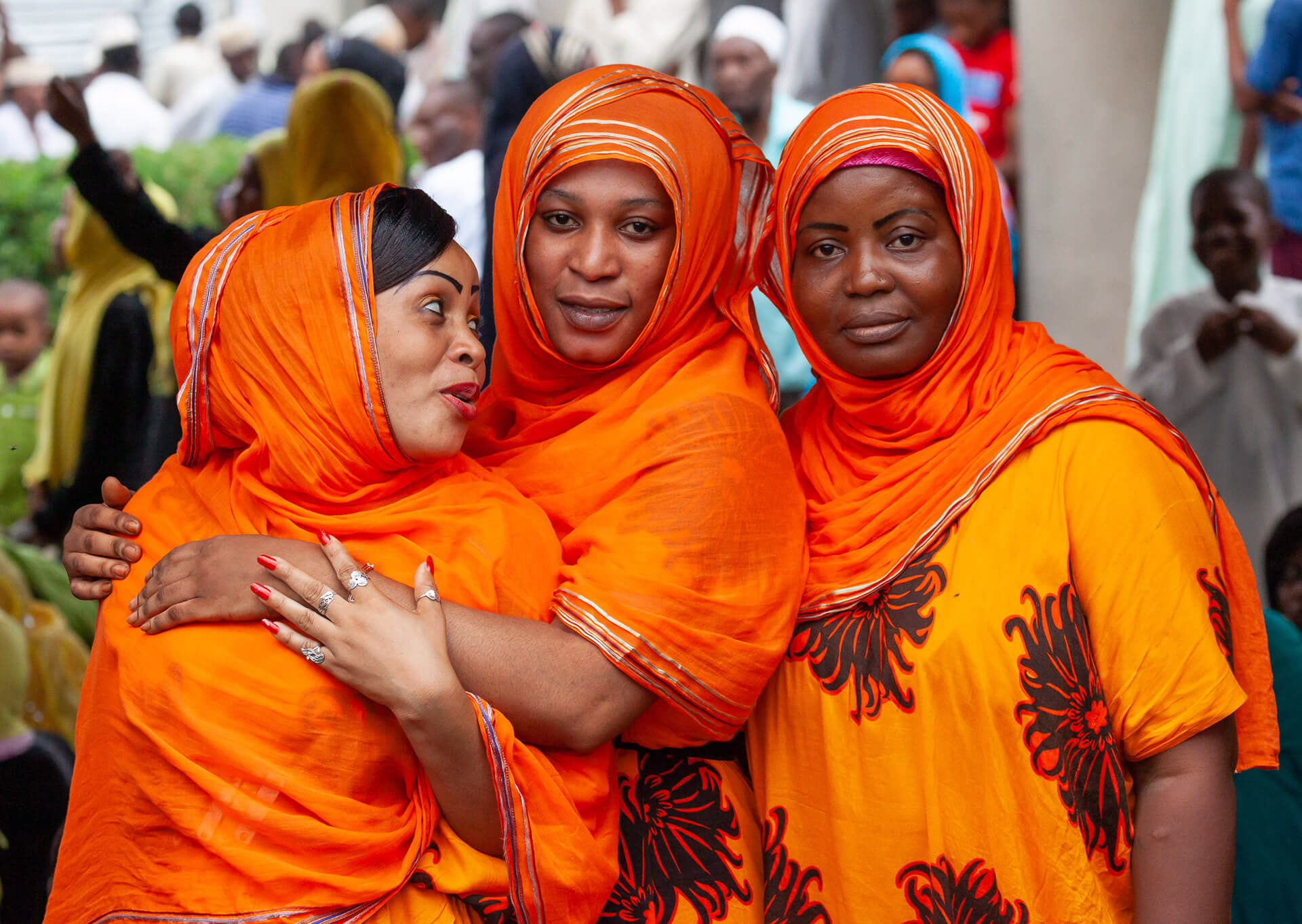 Three women at a Muslim wedding in Maumbusho, Dar es Salaam, Tanzania