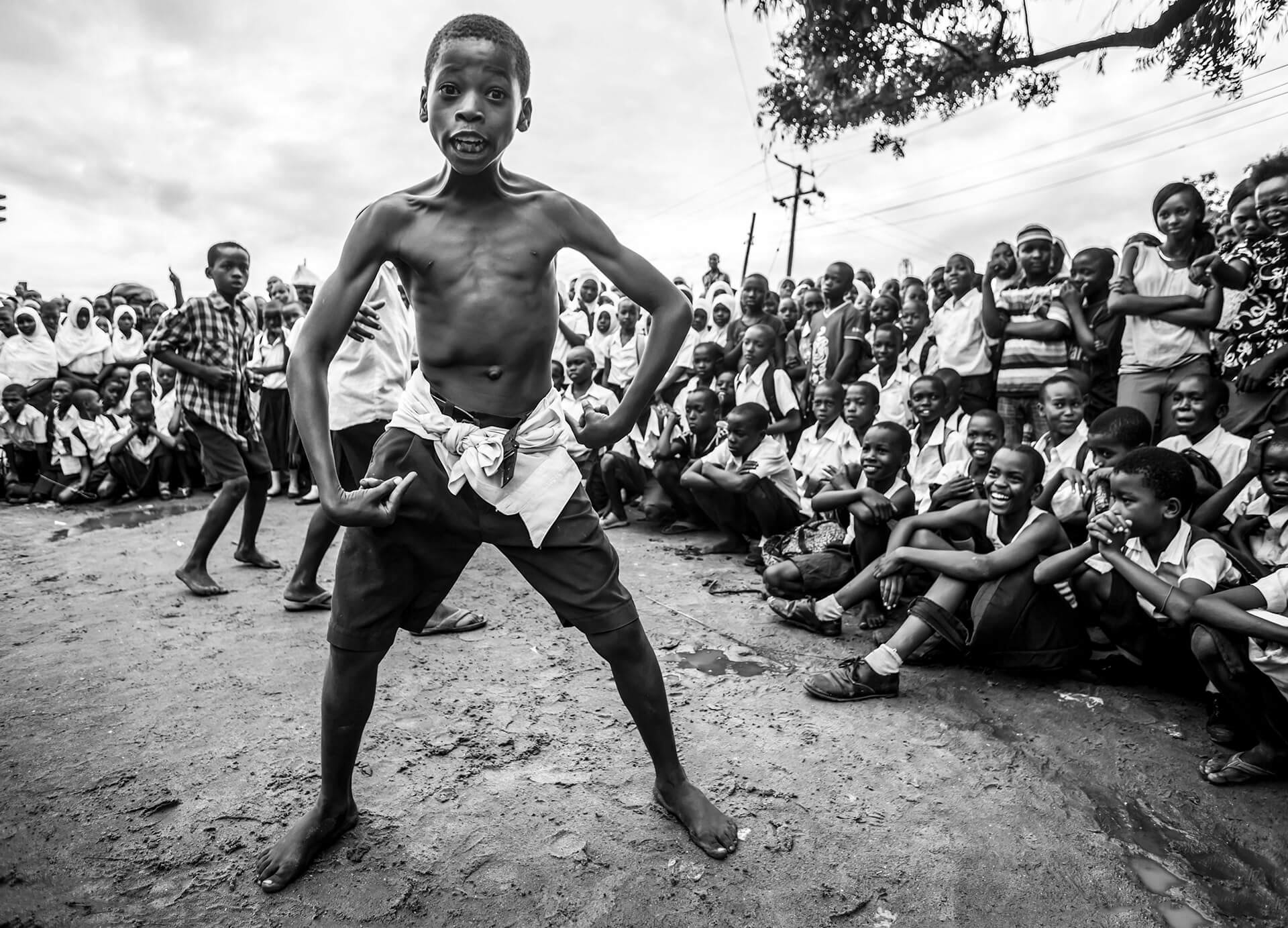 Young boy participating in a dance contest in Vingunguti, Dar es Salaam, Tanzania