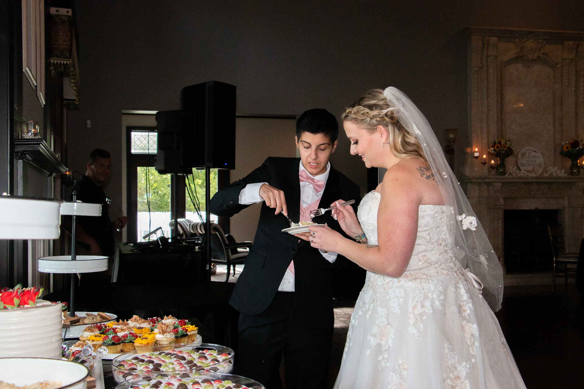 Wedding, cake cutting at Avanti Mansion, Hamburg, NY, bride & bride.