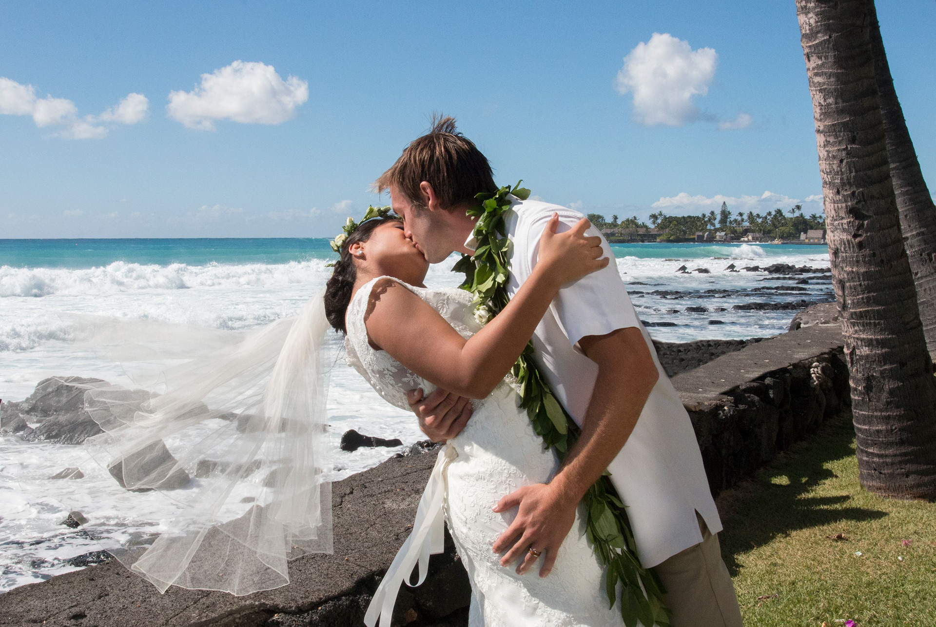 Bride and groom after ceremony, beachfront, Kona, Hawaii.