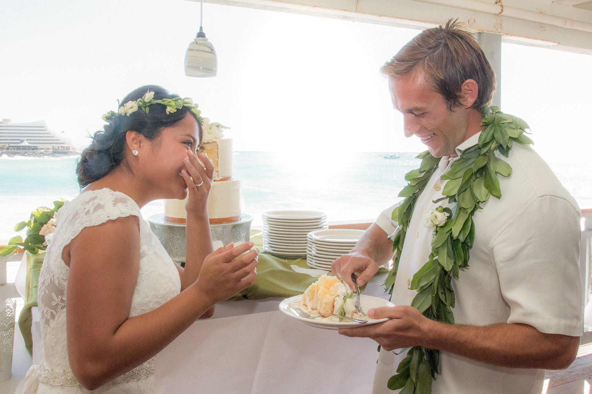 Wedding reception Hawaii, cutting cake, restaurant in Kona.