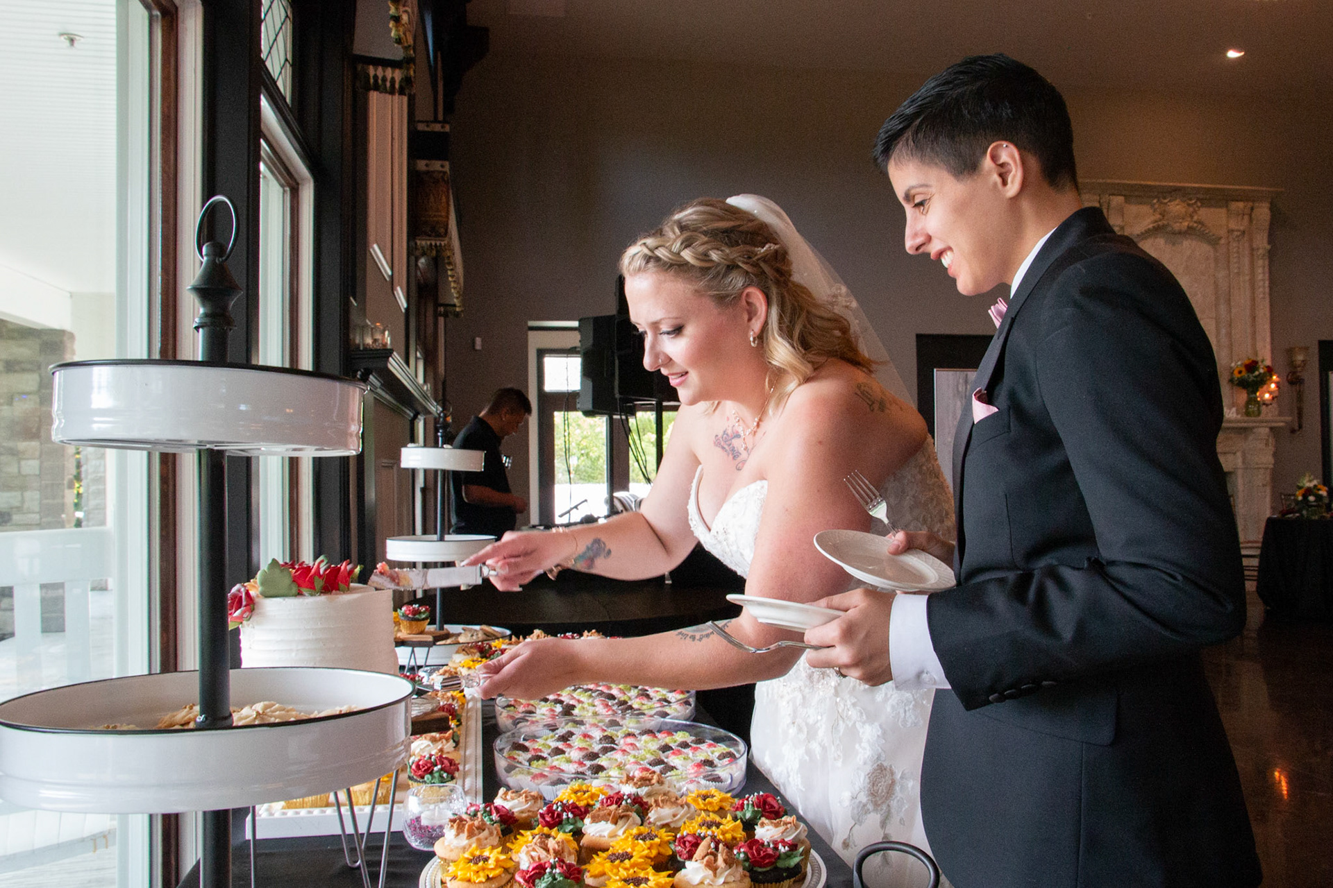 Wedding, cake cutting at Avanti Mansion, Hamburg, NY, bride & bride.