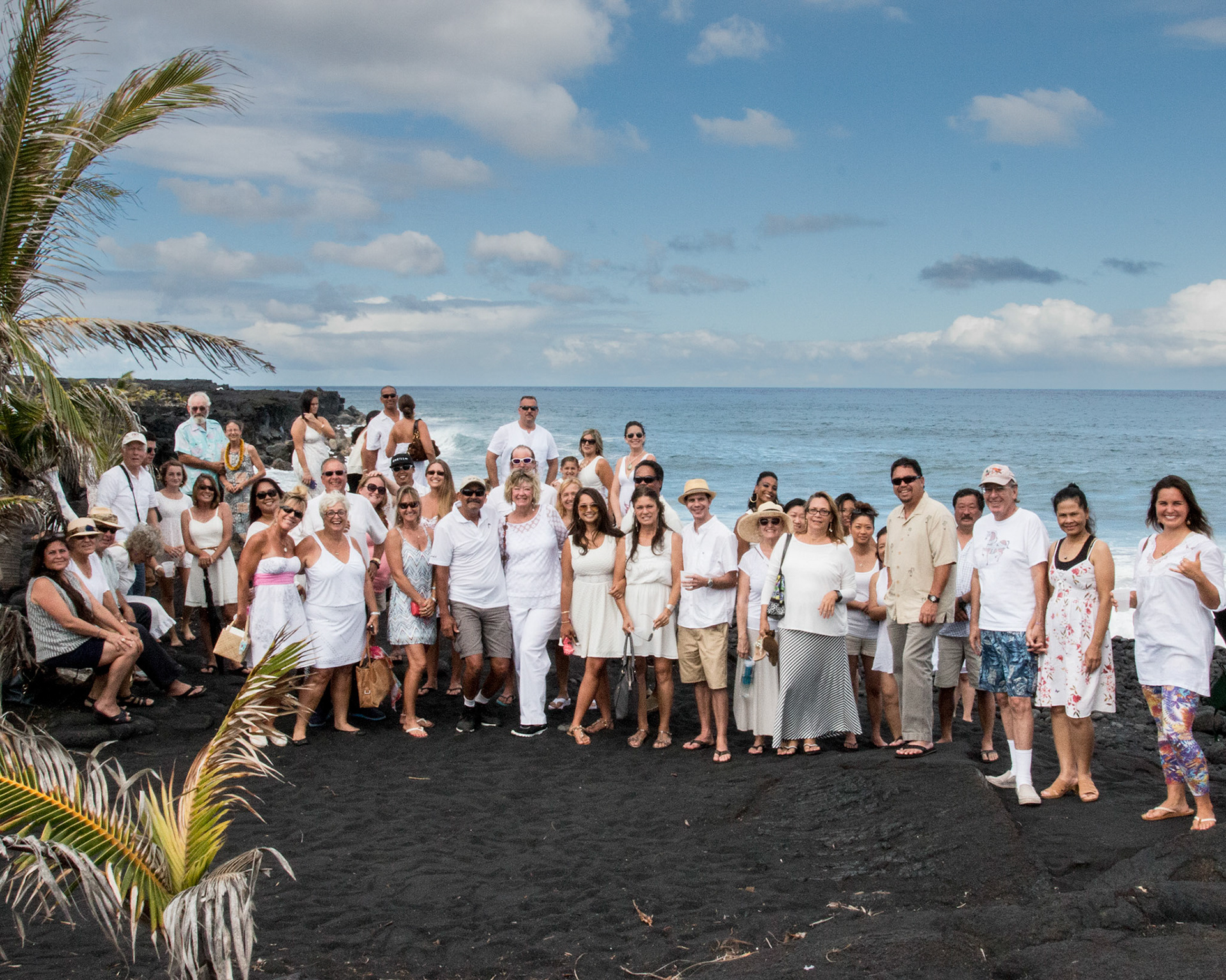 Wedding Hawaii, guest group shot on black sand beach.