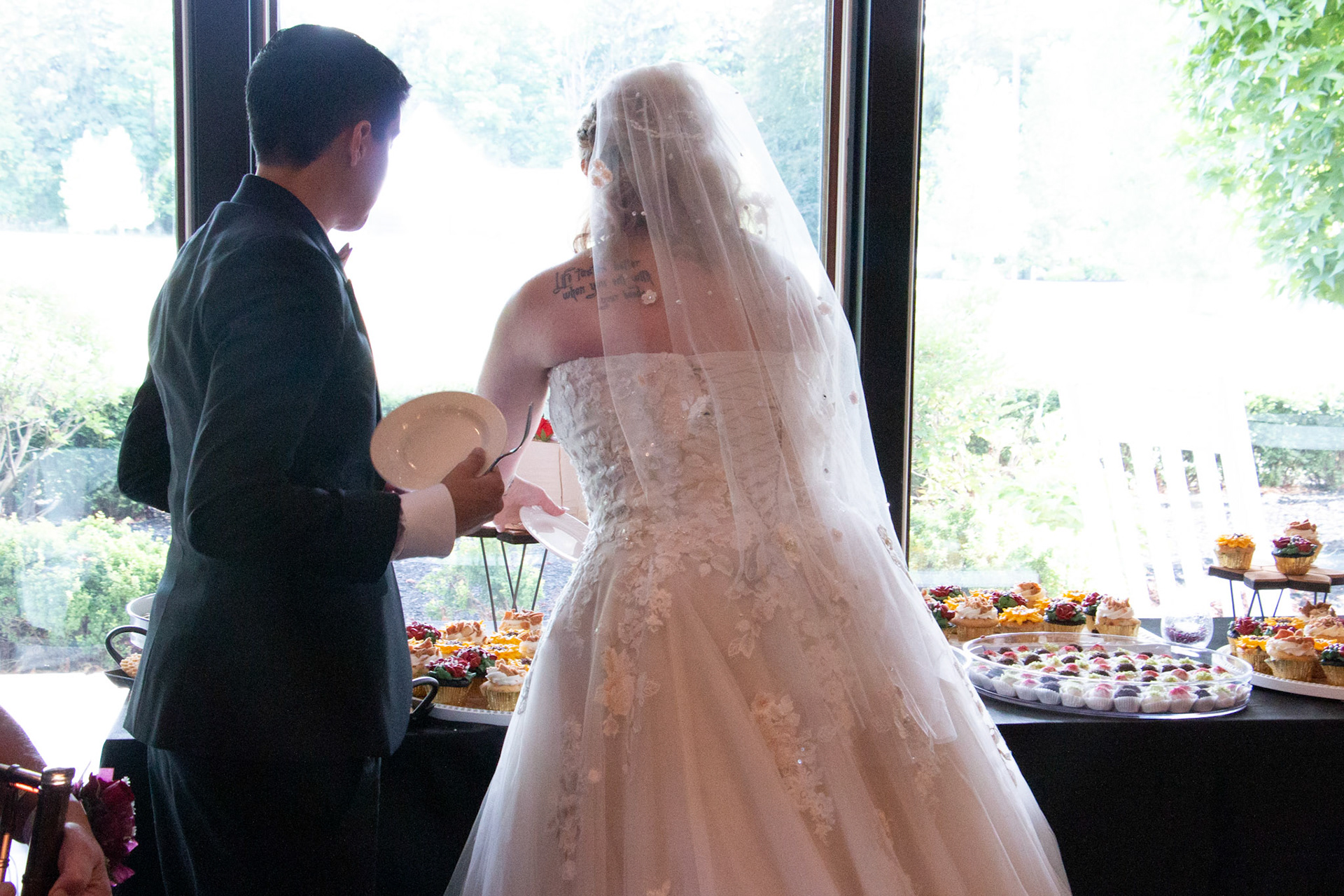 Wedding, cake cutting at Avanti Mansion, Hamburg, NY, bride & bride.