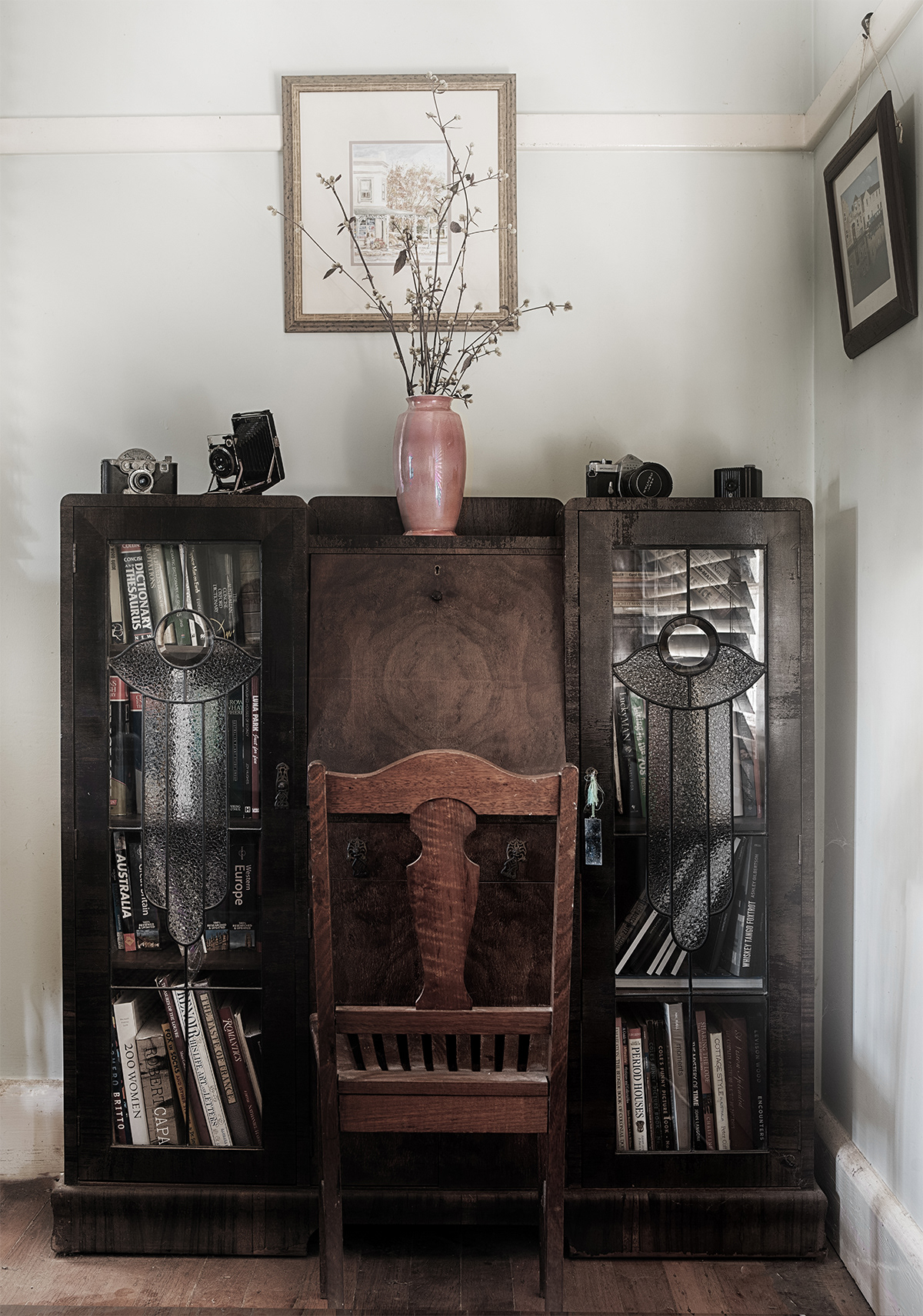 An Art Deco writing bureau sits in another corner of the drawing room. Ruby Leaf (Rubiginosa) provided by our garden