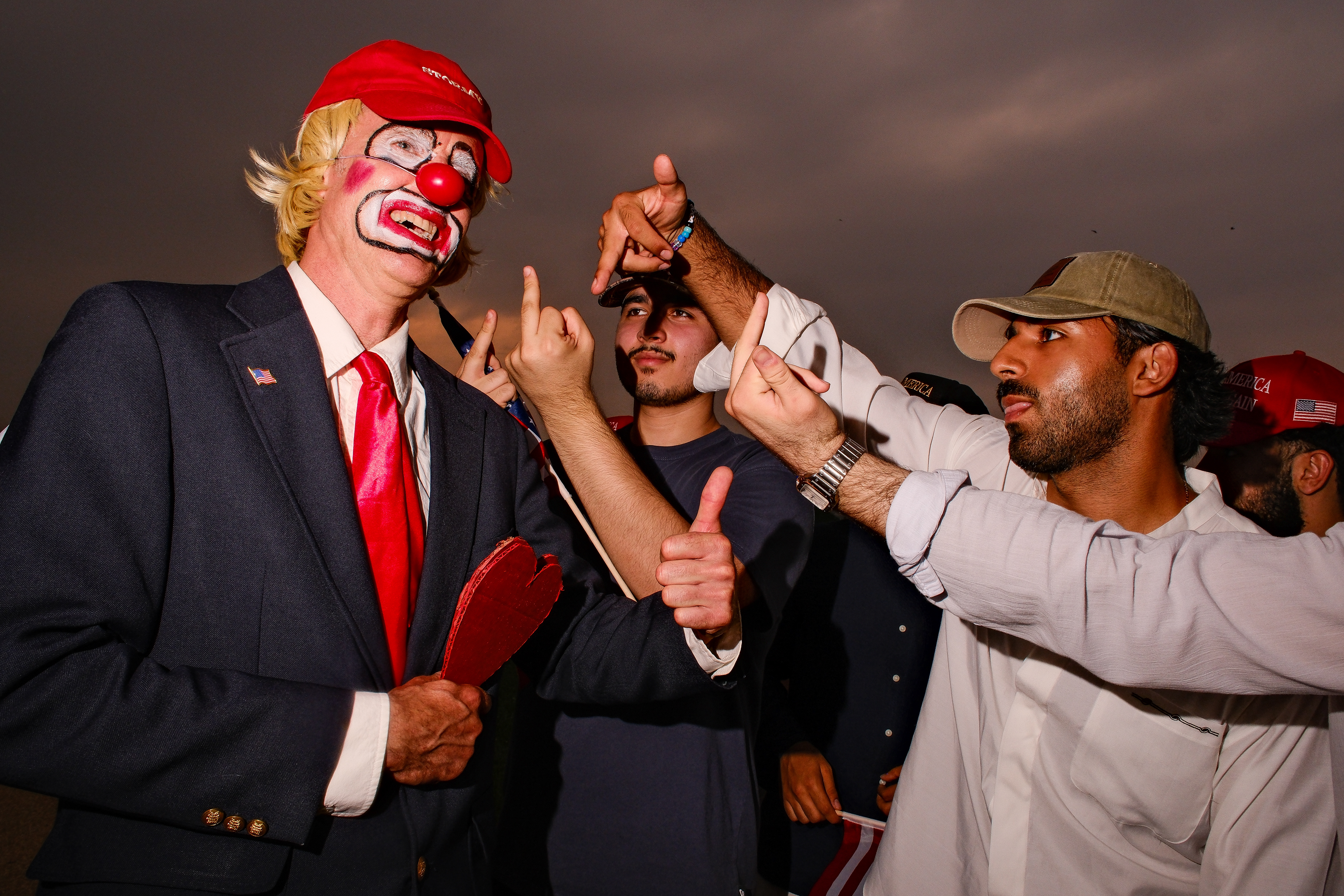 MAGA's confronting (and nearly assaulting) an anti-Trump protestor during Trumps military parade, 6/14/25