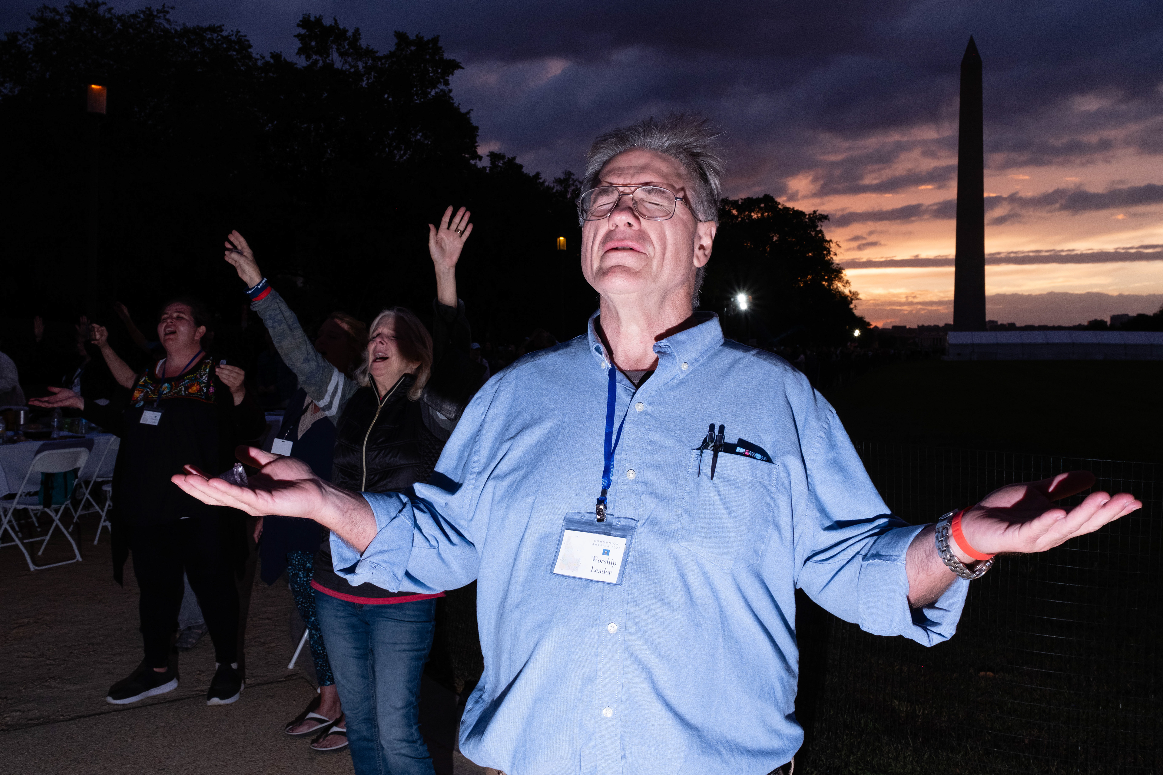 A pastor experiences the afterglow of communion as the sun sets on the National Mall.