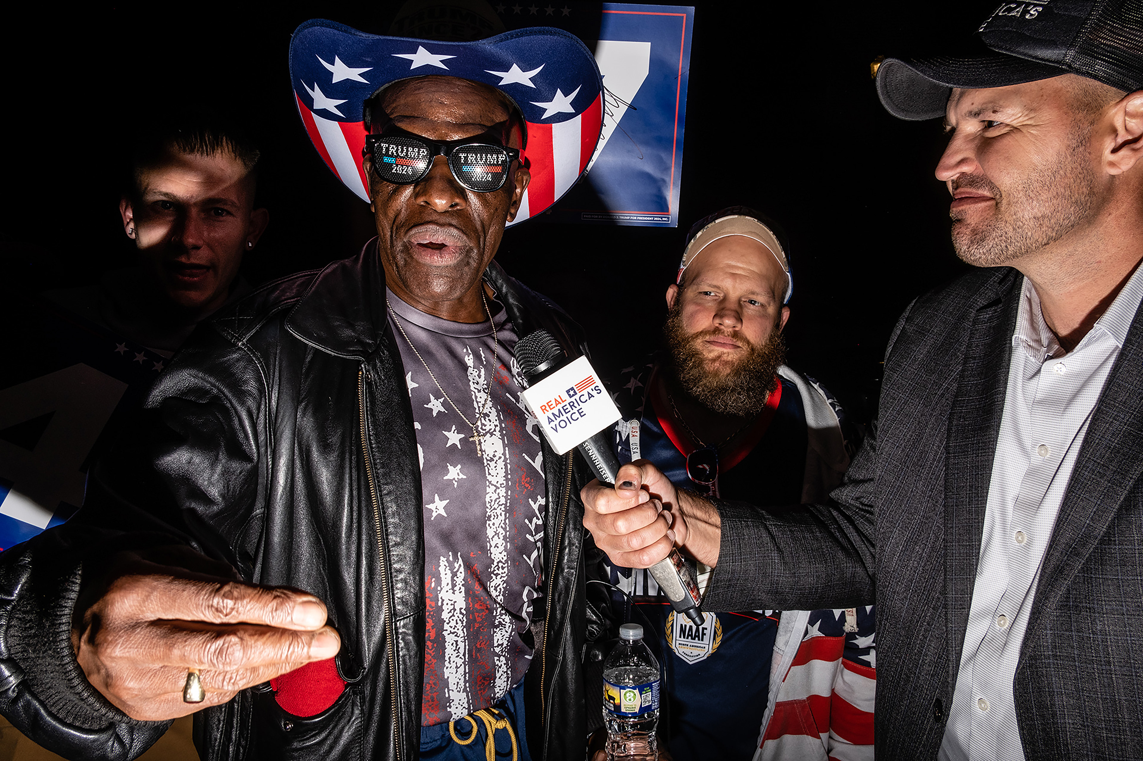 Trump supporters  being interviewed by Real America's Voice outside a Trump rally in Lancaster PA, 10/20/24