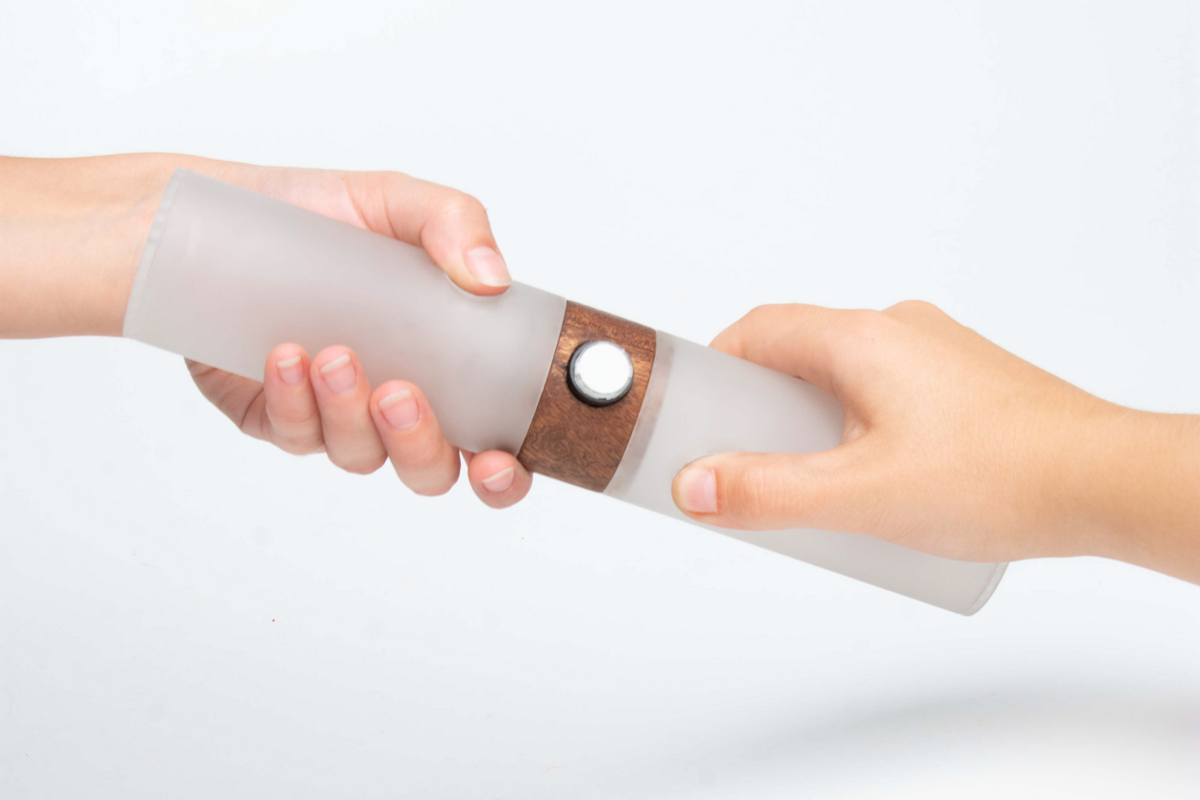Each person grabs one end. The pressure will trigger a burst of laughter from the device itself. It is supposed to make the two people laugh, maybe start a conversation and finally, create a bond between them.