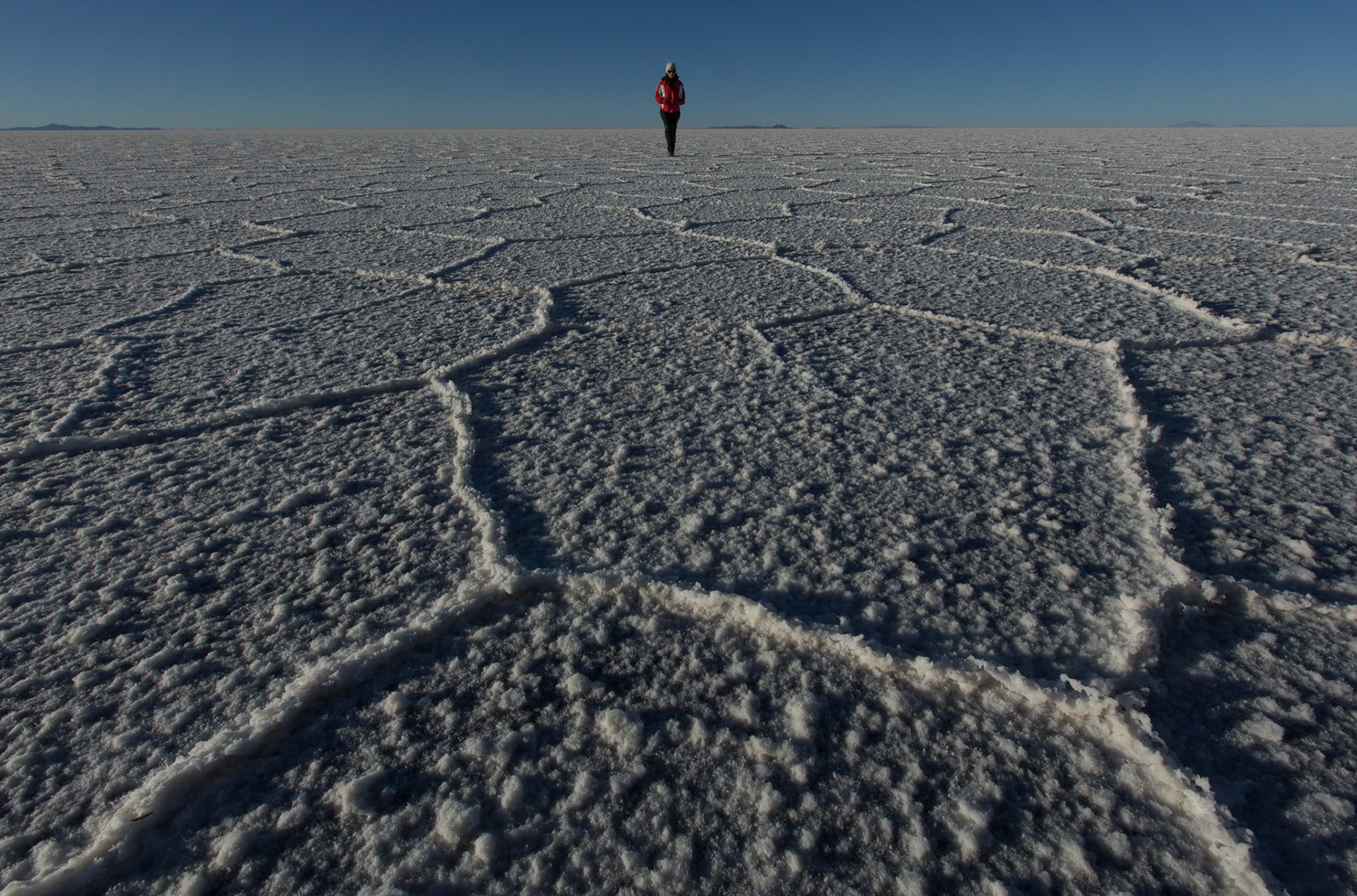 Salar de Uyuni, Bolivia. We spent the night close to the salar to get there very early in the morning to be able to walk and take pictures before sunrise. The landscape and the light were even more incredible that I had imagined. When the sun rose, we remained silent while having the impression on walking on a white sea