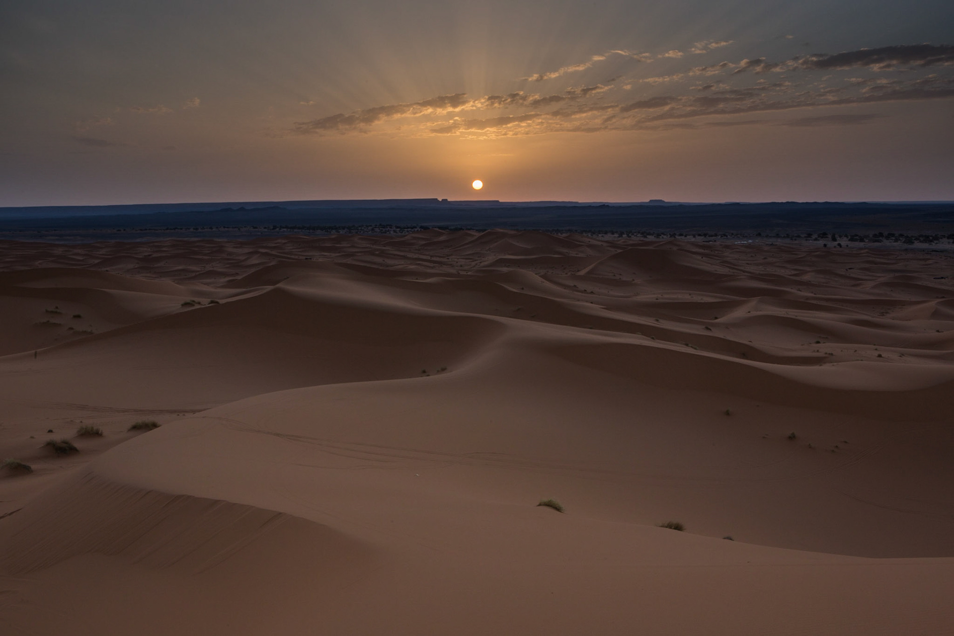 Merzouga is a small village in southeastern Morocco, about 35 kilometres southeast of Rissani, about 55 kilometers from Erfoud, and about 50 kilometers from the Algerian border.The village is known for its proximity to Erg Chebbi, a Saharan broad, flat area of desert covered with wind-swept sand with little or no vegetative cover.