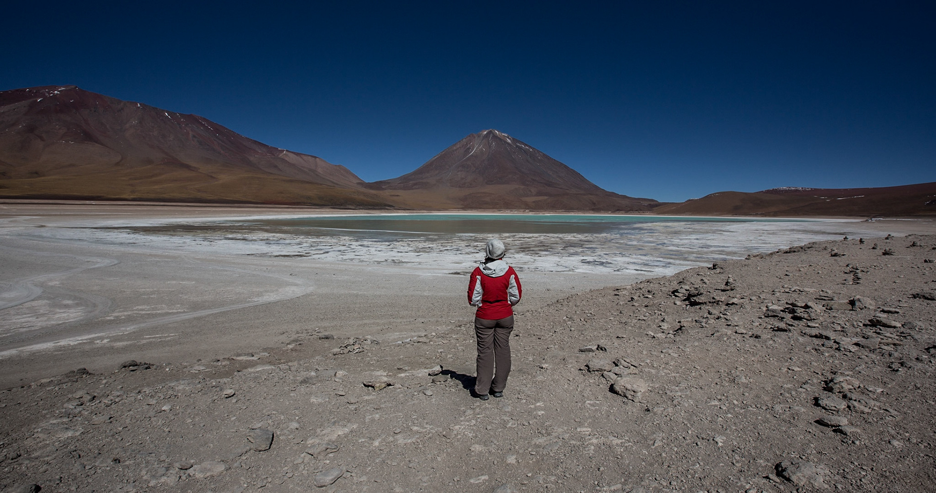 Laguna Verde is a high-altitude salt lake in southwest Bolivia, known for its green color. It sits at the foot of 2 volcanoes, Licancabur (with its perfect pyramid shape) and Juriques.
