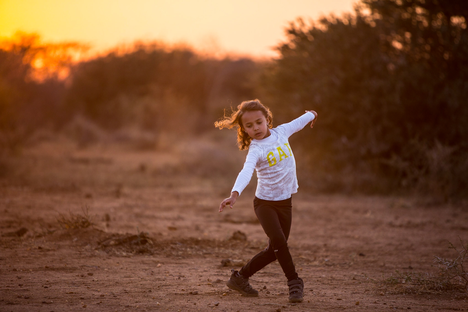 My 6-year old daughter Sofia, having a solo-dance moment in beautiful Madikwe Game Reserve north of South Africa, under a light that only exists in Africa