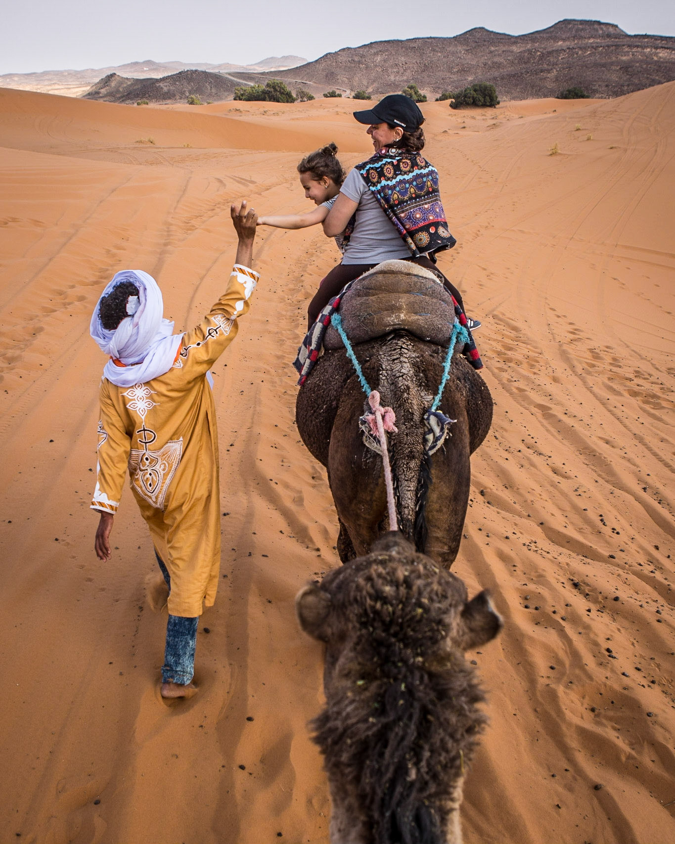 Merzouga is a small village in southeastern Morocco, about 55 kilometers from Erfoud, and about 50 kilometers from the Algerian border.The village is known for its proximity to Erg Chebbi, a Saharan broad, flat area of desert covered with wind-swept sand with little or no vegetative cover. It is a true delight to ride a dromedary in this area with the friendly Berber inhabitants.