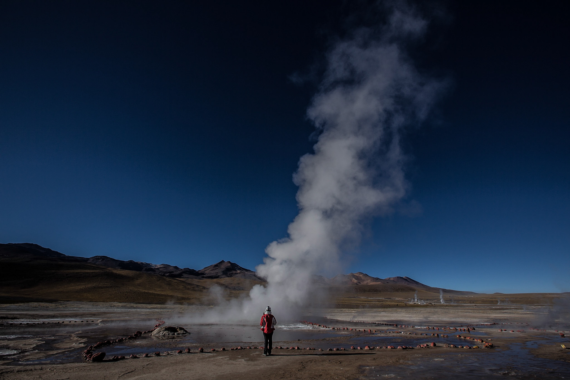 El Tatio is a geyser field located within the Andes Mountains of northern Chile at 4,320 meters above mean sea level. Its name comes from the Quechua word for oven. It is among the highest-elevation geyser fields in the world. El Tatio has over 80 active geysers, making it the largest geyser field in the southern hemisphere and the third largest in the world.