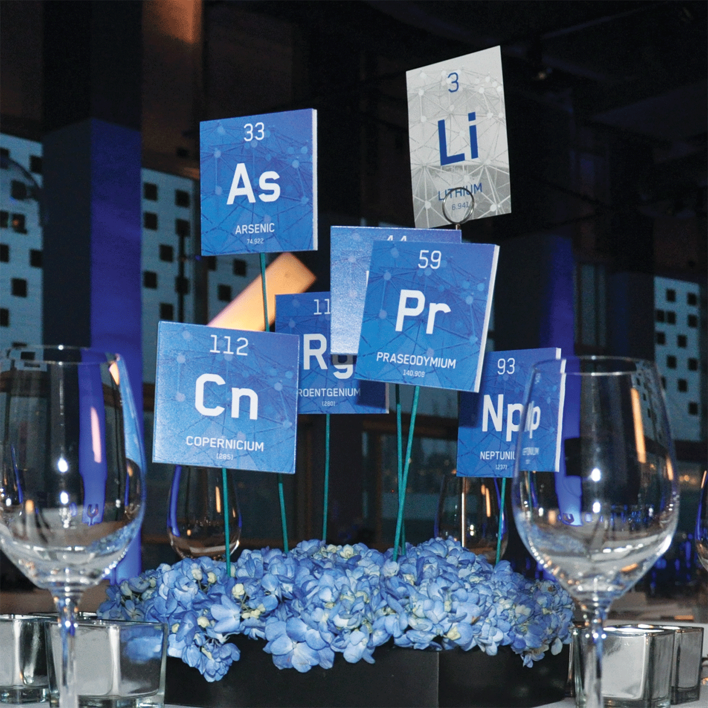 Symbols of chemical elements, used as table numbers and decorations.