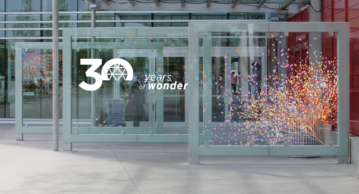 Wind barrier graphics, designed to activate the space outside the entrance of TELUS World of Science.