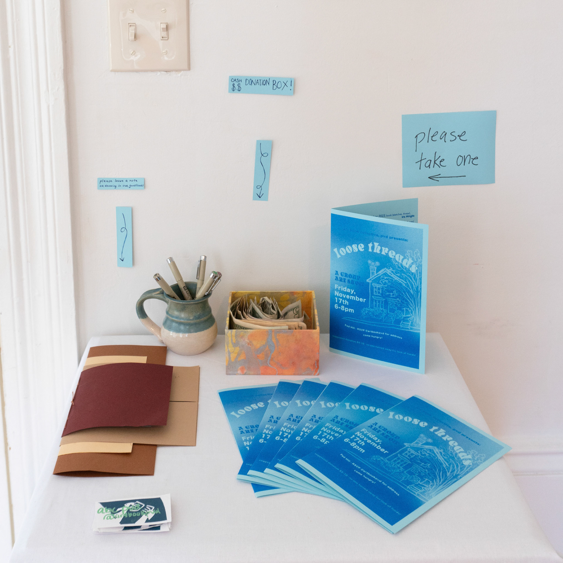 show poster design by Hannah Bashkow, guest book (left) by Iris Wright, collection box by Ivana Primero, programs risograph printed by Jaden Bleier