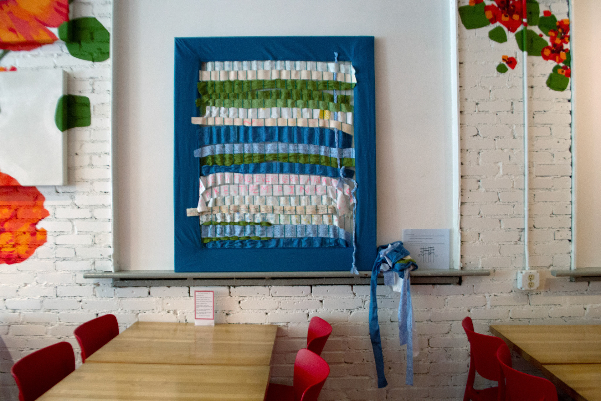 communal weaving begun at the exhibition reception