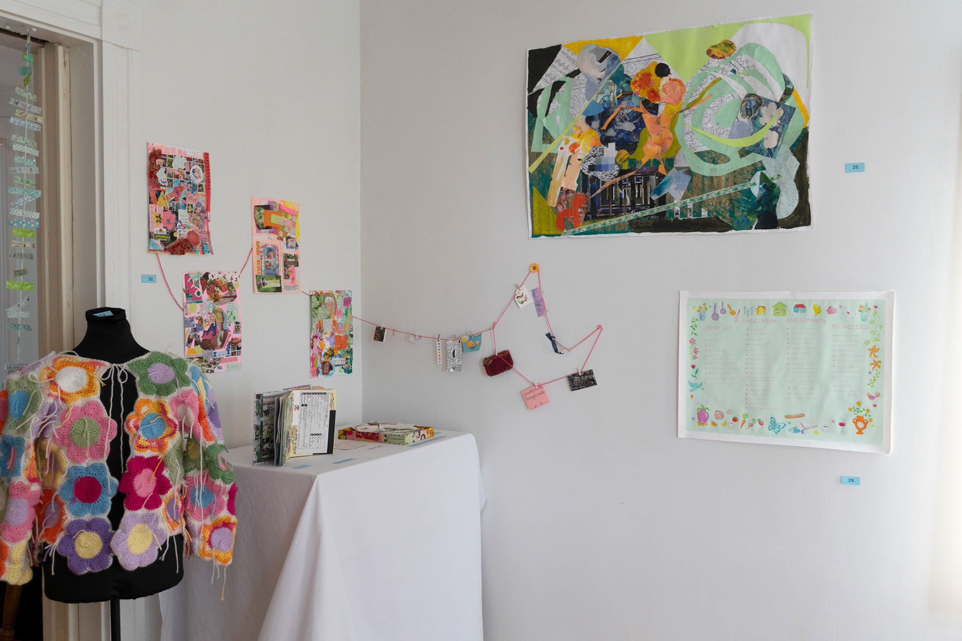 left to right: "just a craft (sweater)" by Hannah Bashkow, "over and over again i just want to pay homage: a collage book" by Ivana Primero, "loose memories" (book box, collage scraps) by Hannah Bashkow and Ivana Primero, "Spontaneity" (collage) by Ivana Primero, and "untitled (chore chart)" by Hannah Bashkow