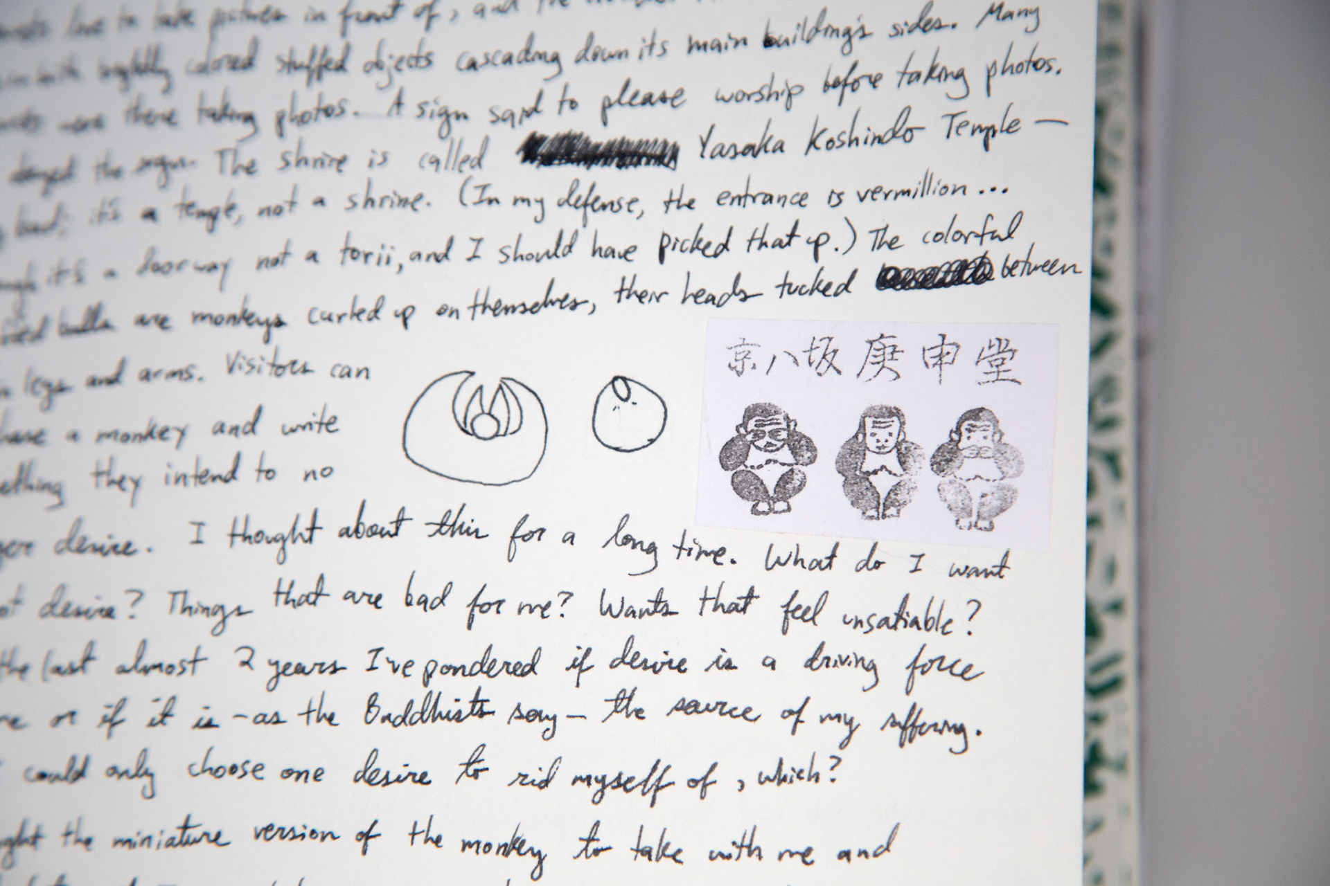 a found stamp and a pen drawing of a monkey